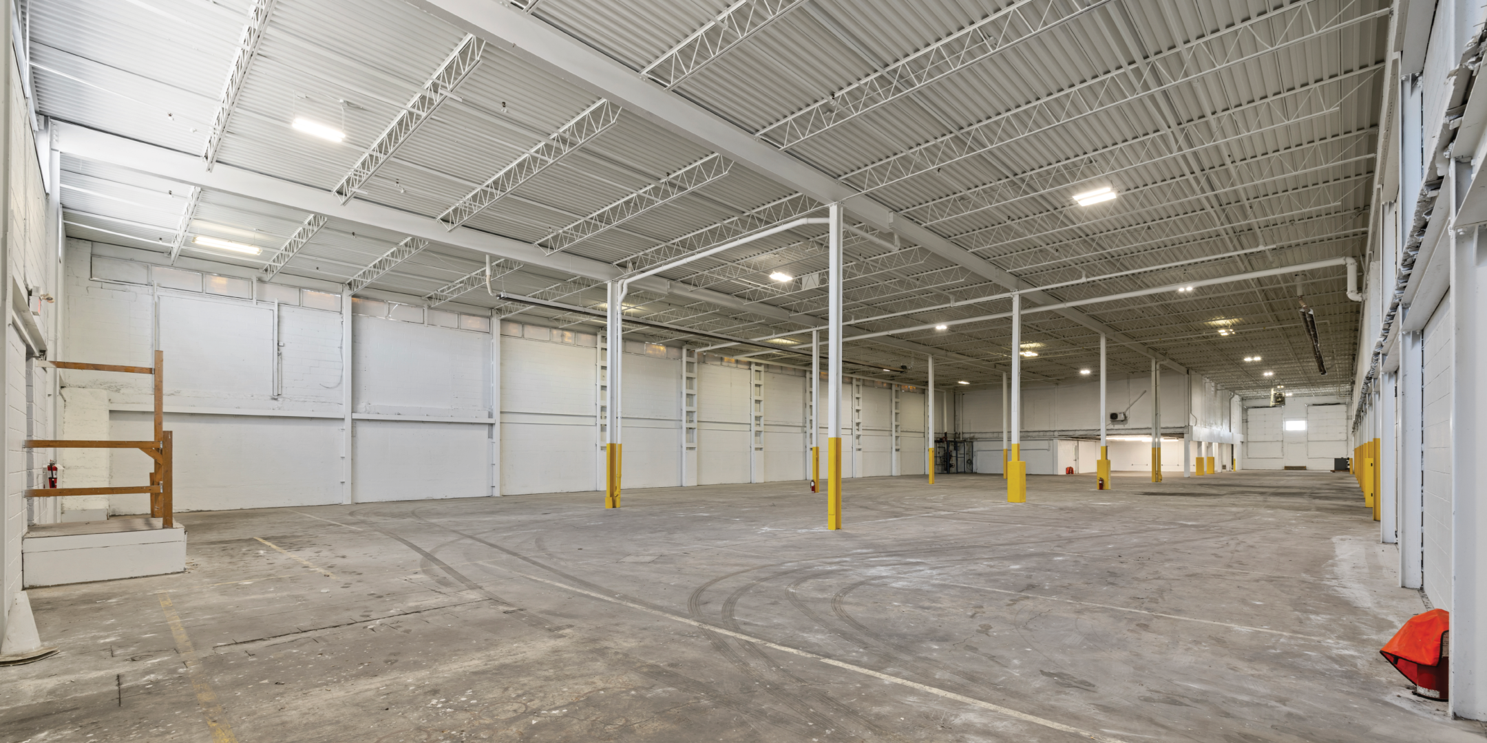 3636 Weston Road interior empty warehouse with concrete floors and painted white walls 