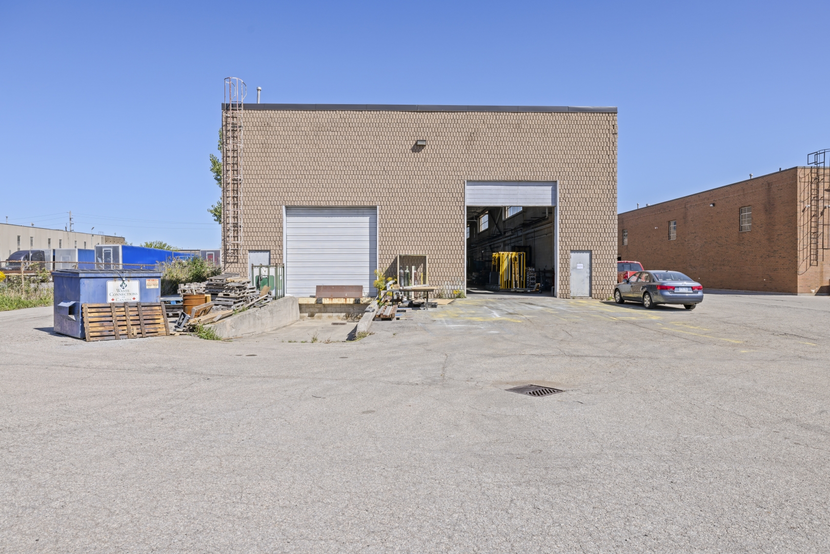 7669 Kimbel Street exterior shipping doors at the rear of building, one truck level and one drive in 