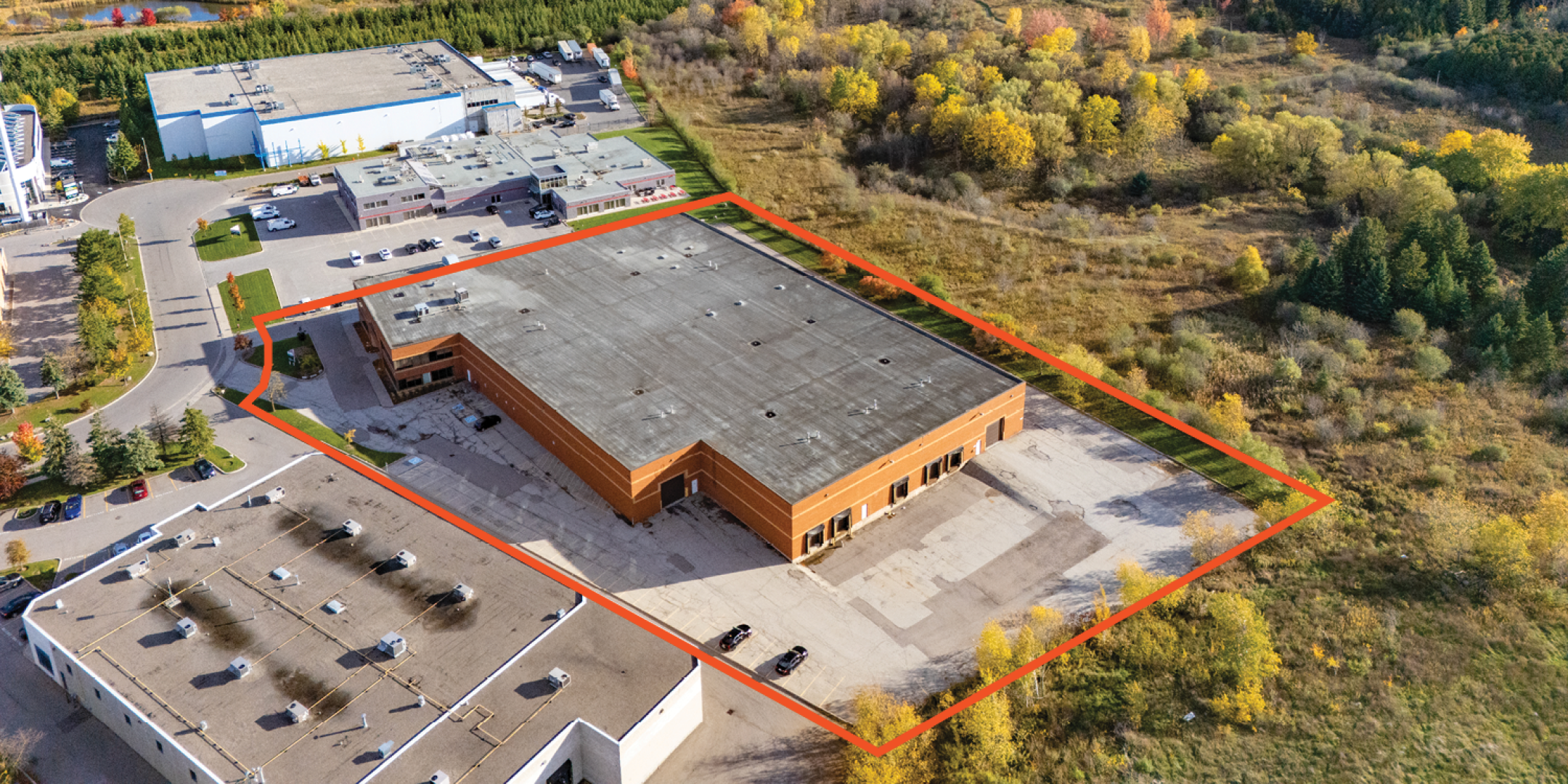 8 Abacus Road Exterior Photo of Industrial Building with Orange Property Outline