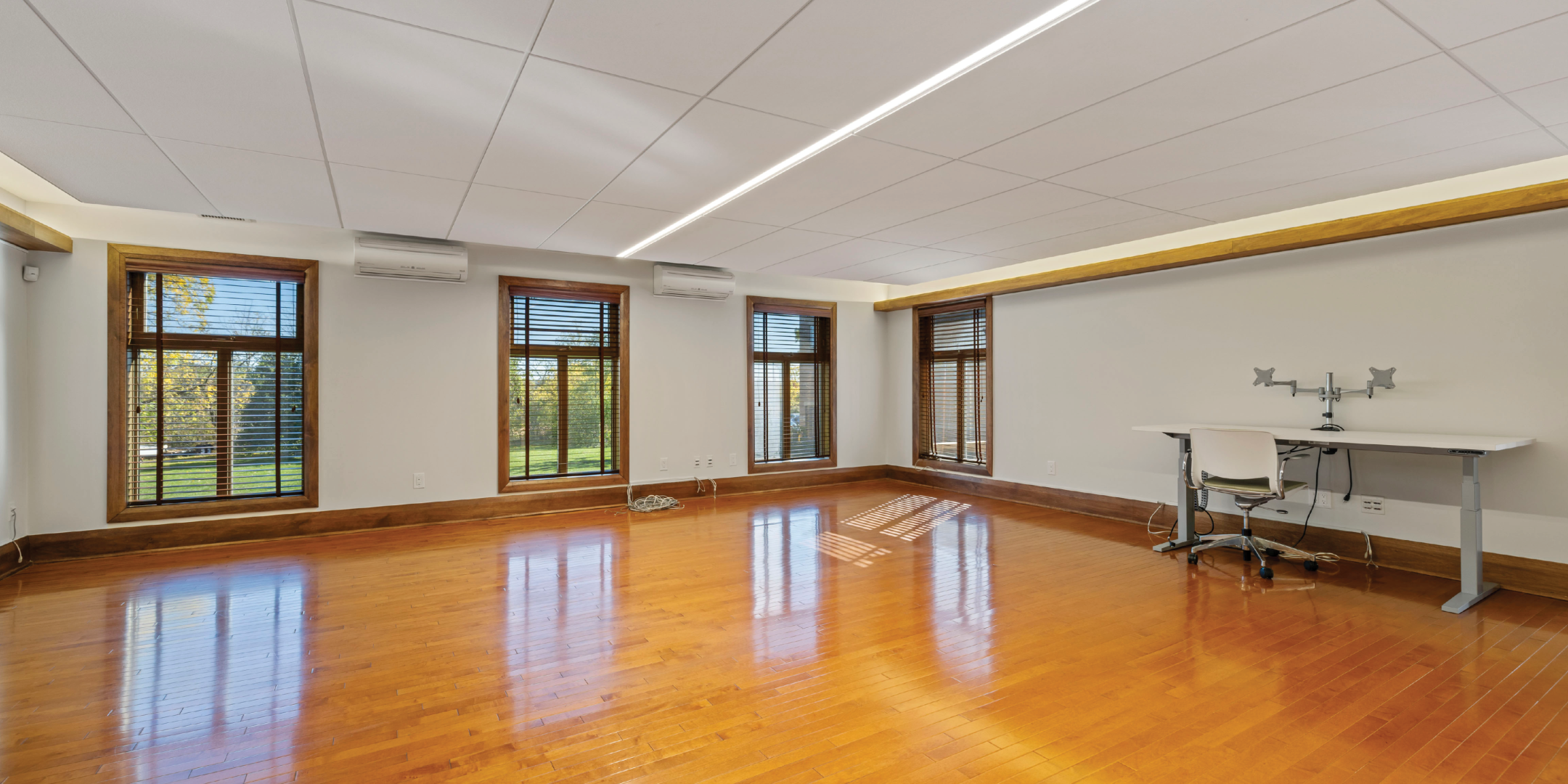 9835 Leslie Street Workspace area with hardwood floors and windows