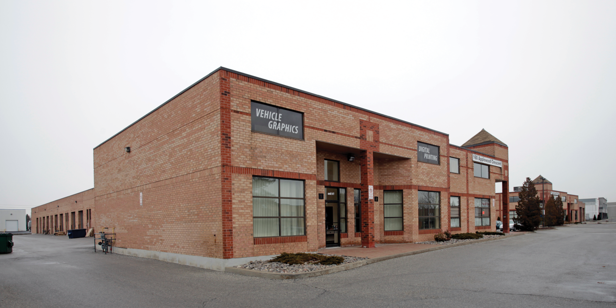 front corner unit of red brick industrial complex