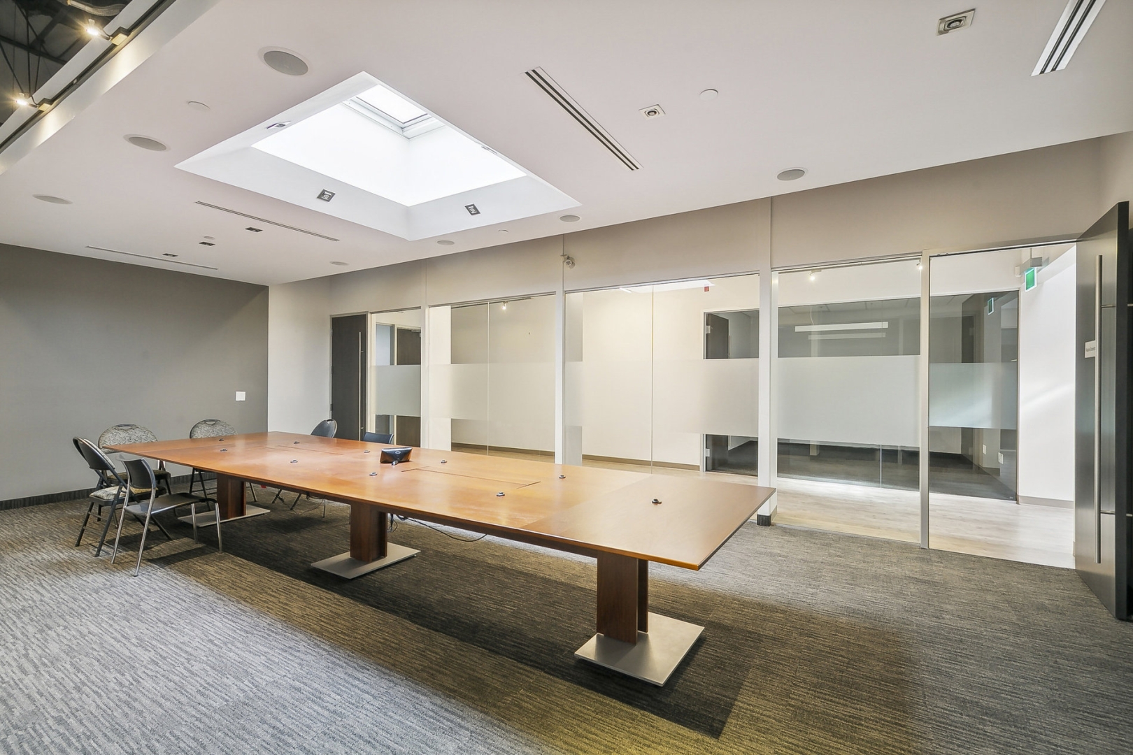 2486 Dunwin Dr boardroom overview with table and chairs