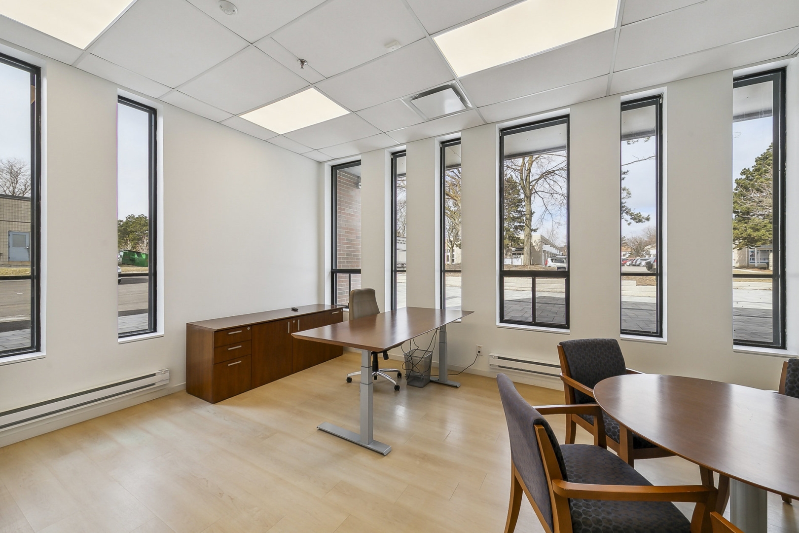 2488 Dunwin Drive corner office with big windows overlooking the table and chairs