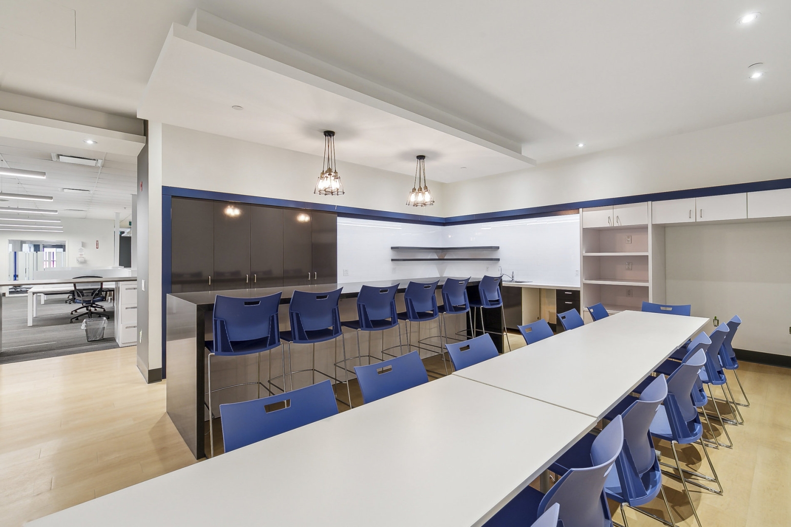 2488 Dunwin Drive work kitchen with table and blue chairs