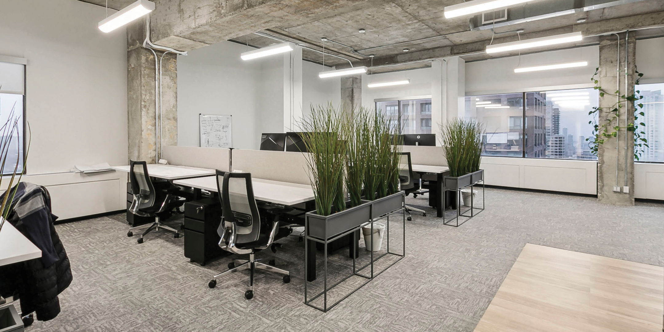 365 Bloor Street E interior view of the office with workstations and big windows