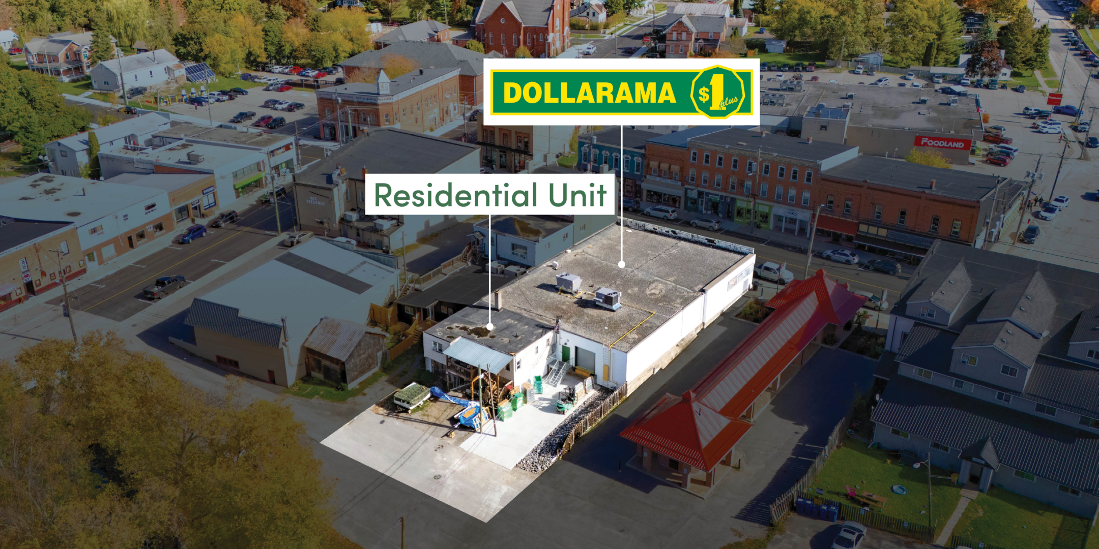 Aerial View of Dollarama store from rear.  showing residential unit
