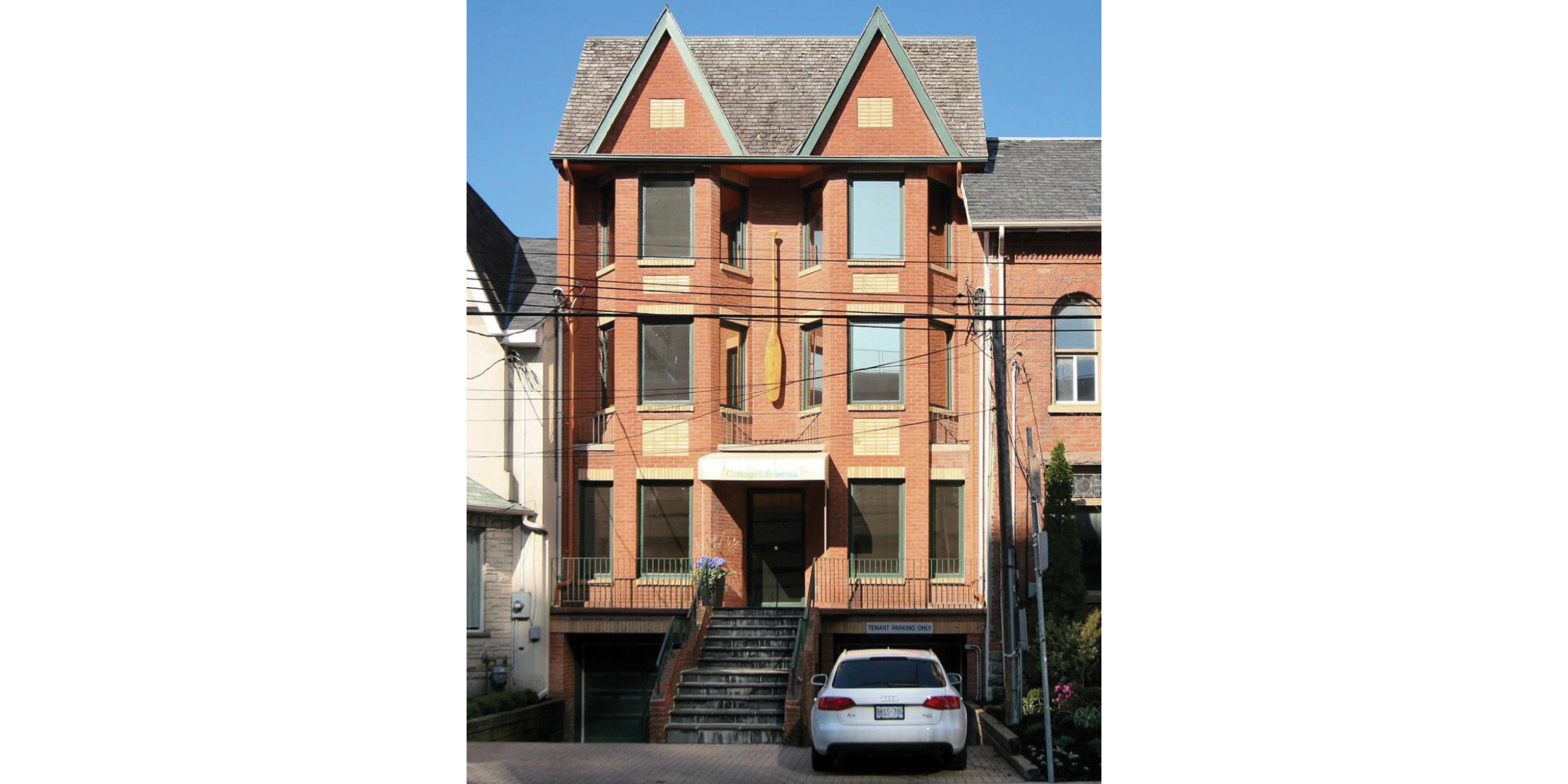 Red brick 3 storey walk-up office building