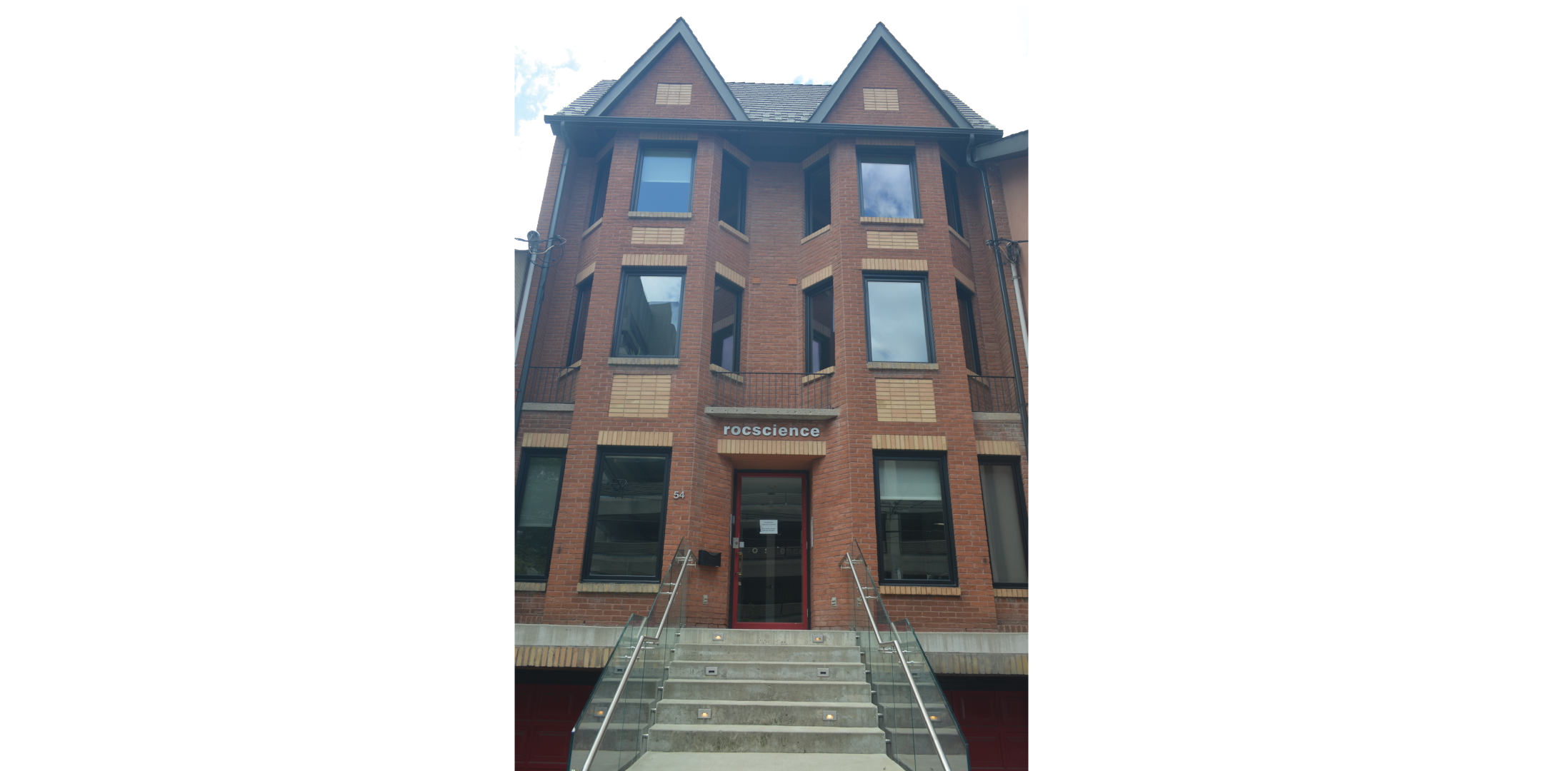 Red brick 3 storey walk-up office building