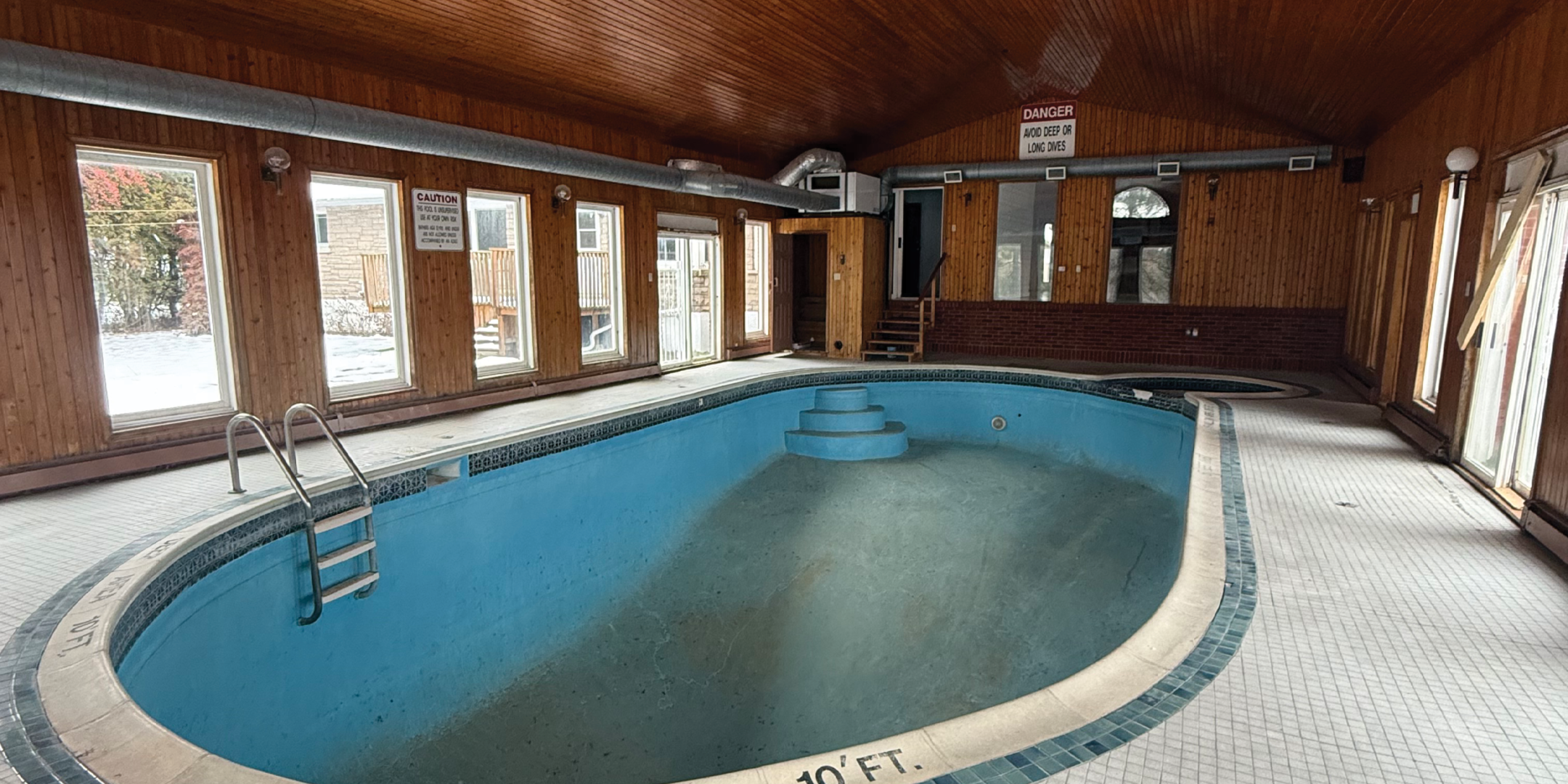Indoor pool with large surrounding deck