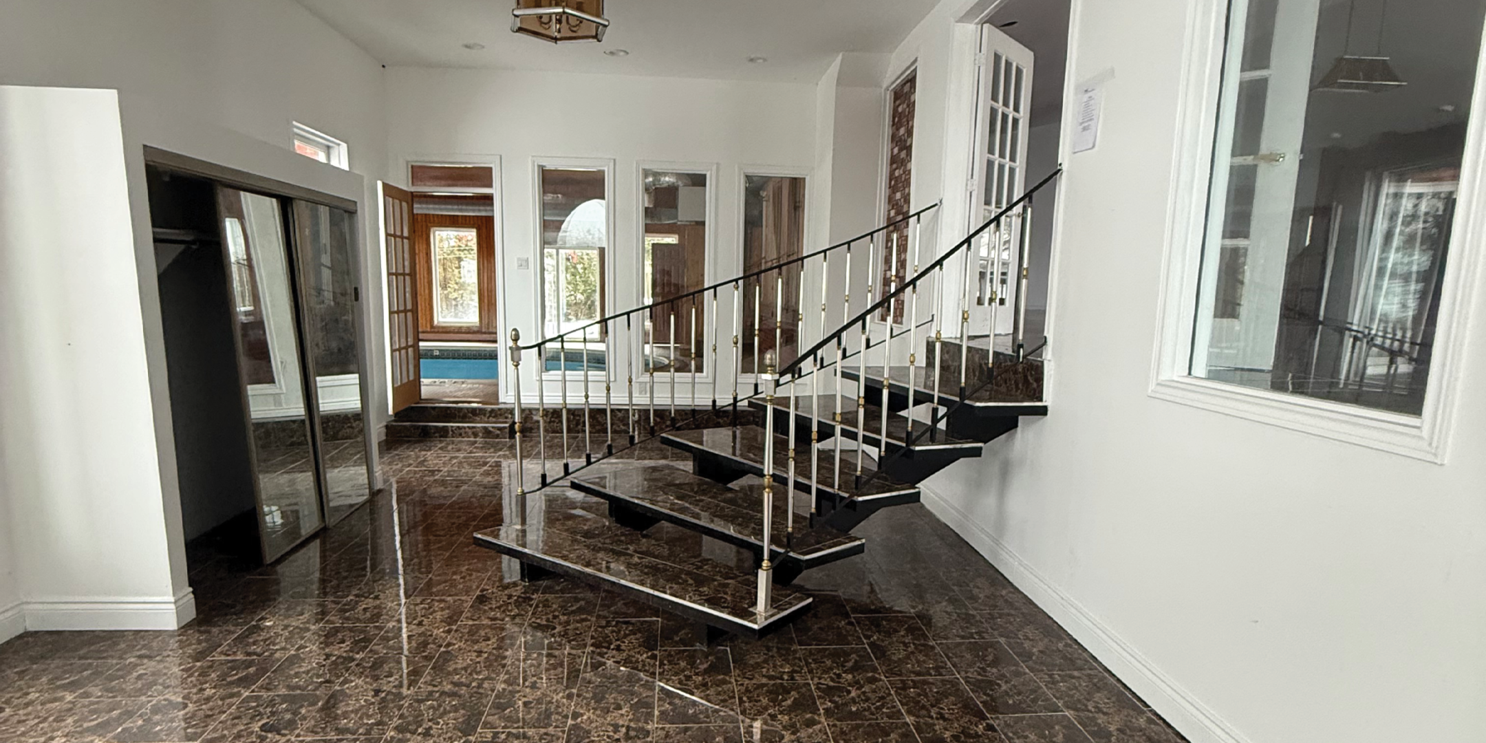 Foyer with grand stairs