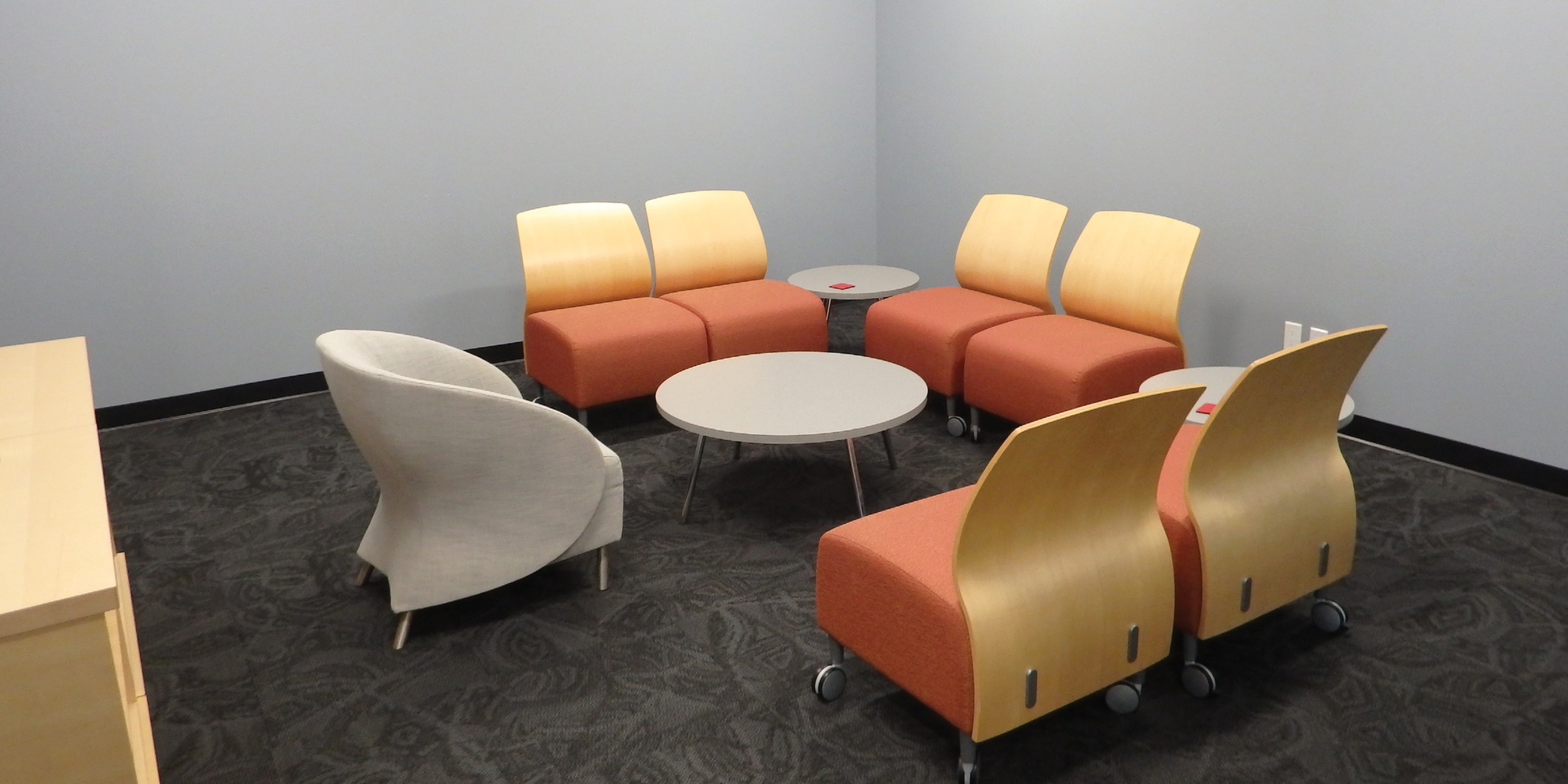 meeting area with 7 chairs and round table