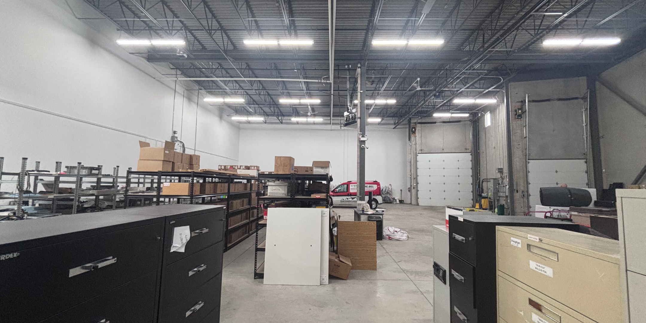 bright warehouse area with product and inside shipping door