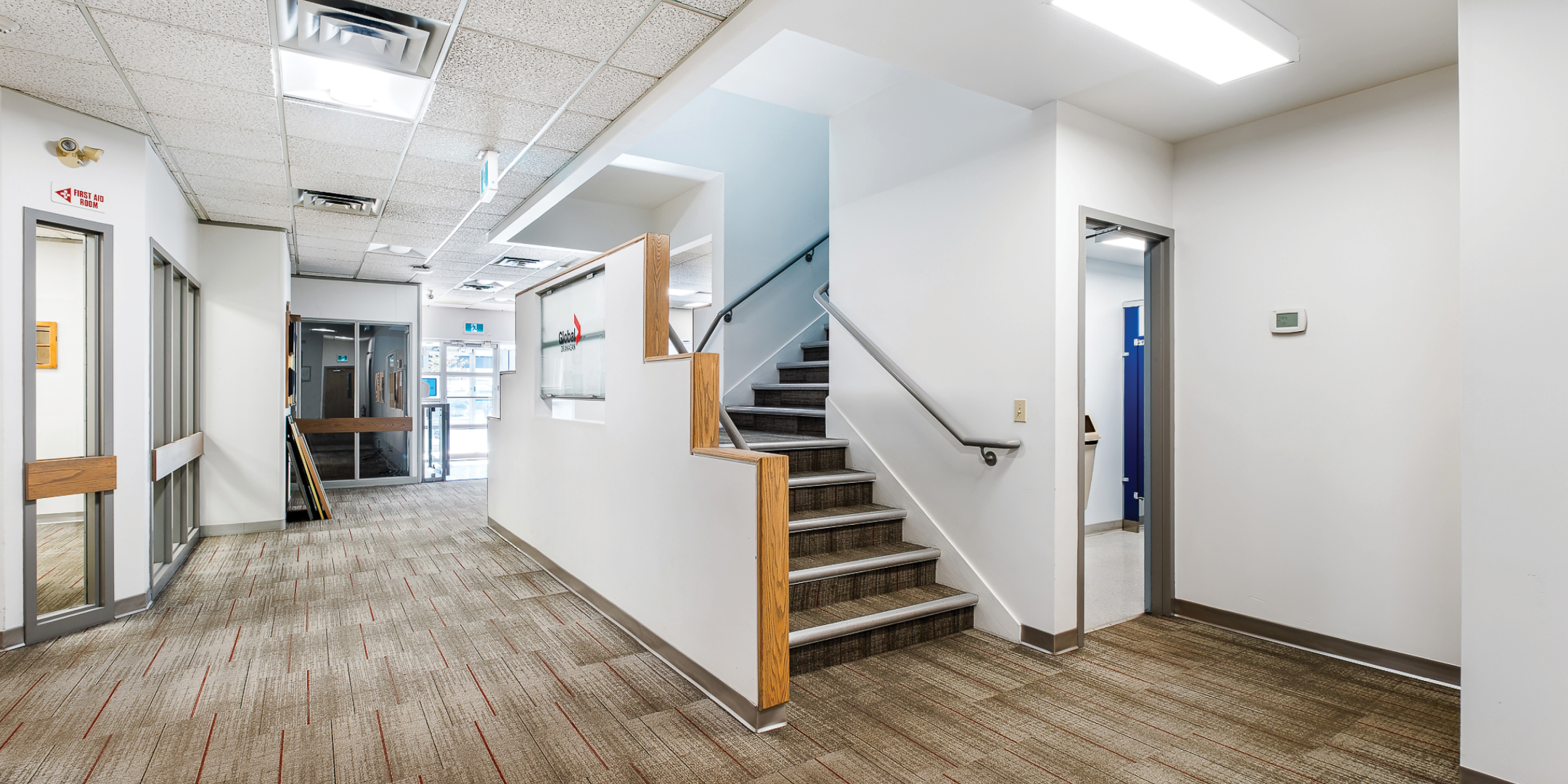 Office area with stairs leading to second floor