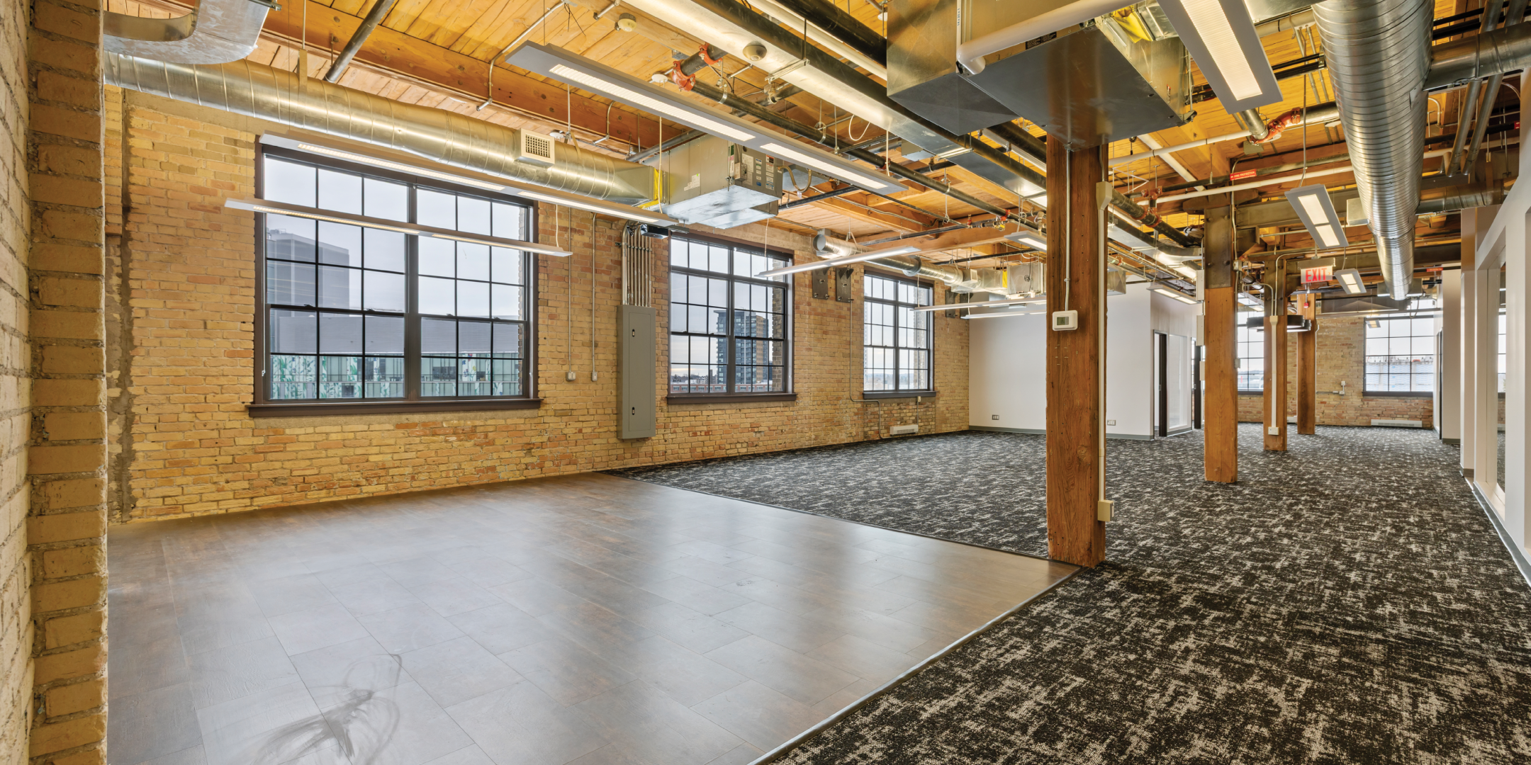 Open area with exposed brick and beam
