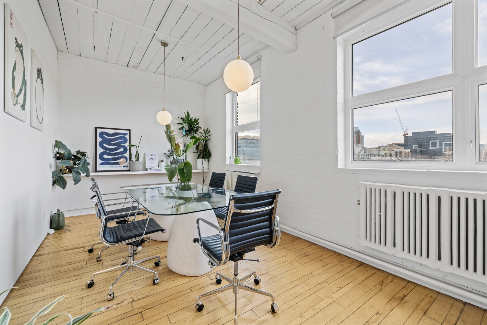 72 Stafford Street meeting room with big window, wall paintings, plants and table & chairs