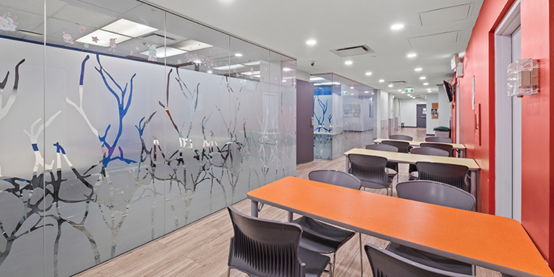 Tables along glass wall