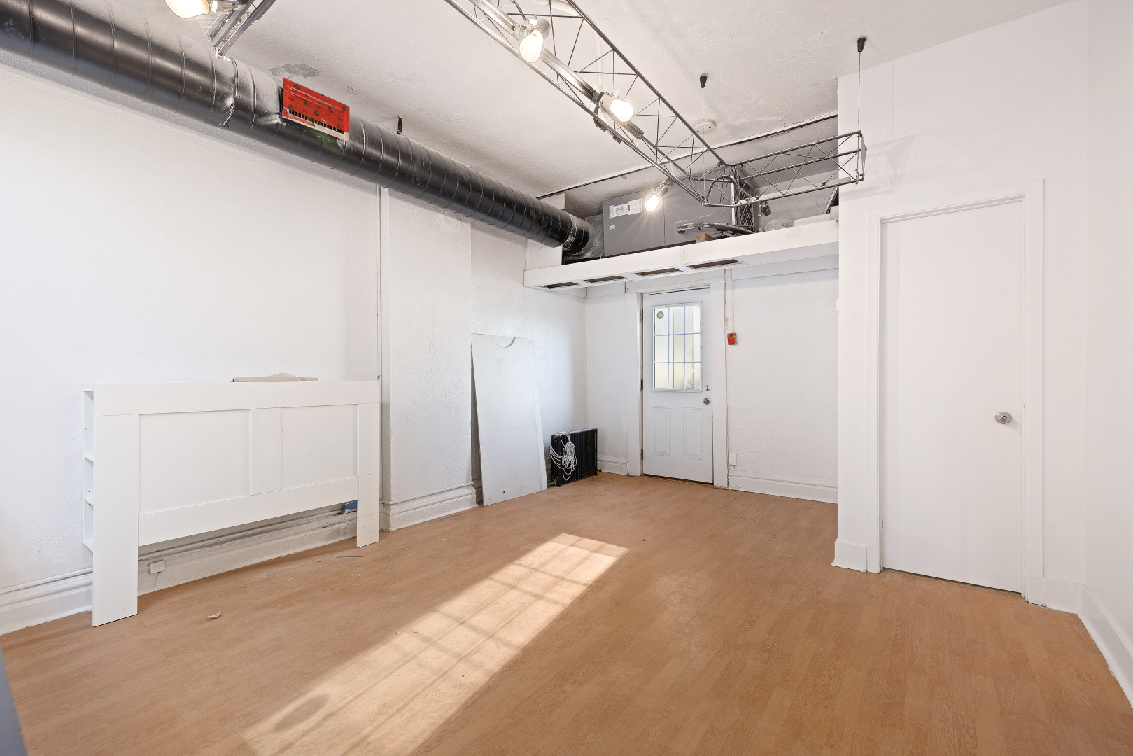 106 Queen Street E 3rd Floor open area with entrance door and window