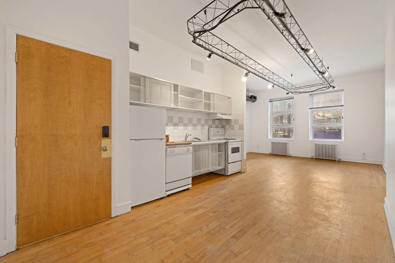 106 Queen Street E 2nd Floor open area with big windows overlooking the kitchen 