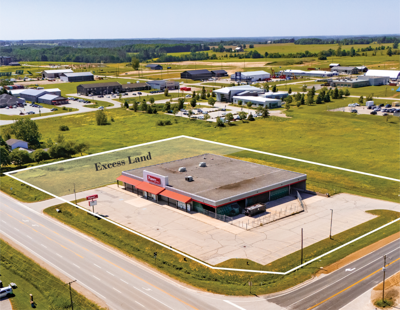Aerial of vacant retail building previously home to Peavey Mart
