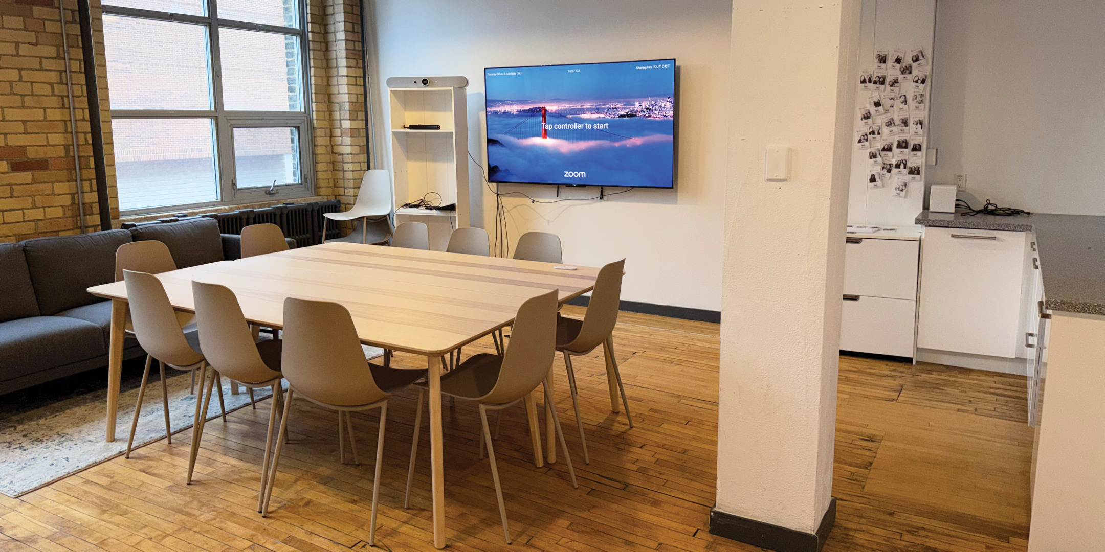 174 Spadina Avenue interior view of the open meeting space with large desk and chairs
