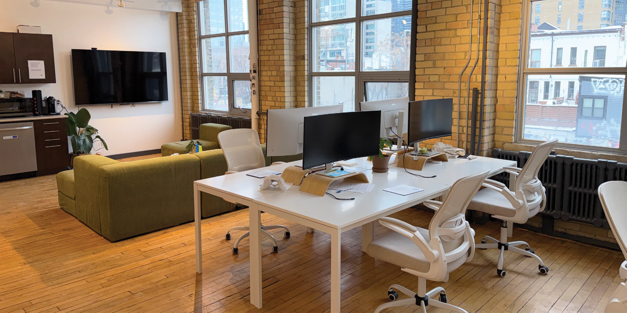 174 Spadina Avenue interior view of the open meeting space with large desk and chairs