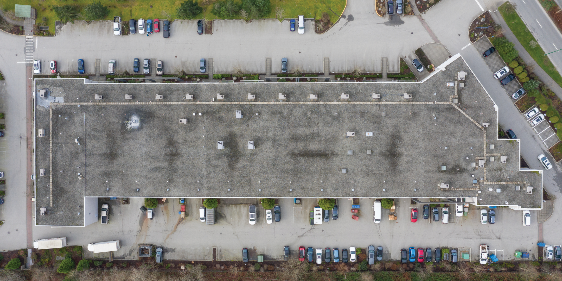 217-2455 Dollarton Highway Bird's Eye View Showing Building and Parking