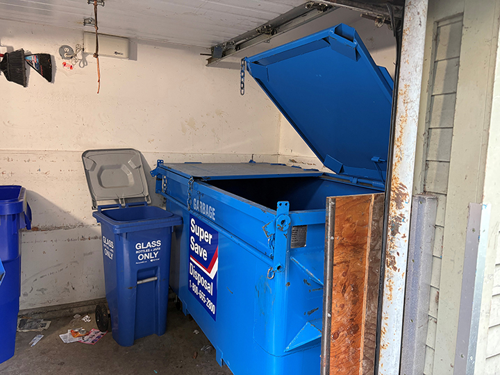 recycling room with extra large commercial blue container
