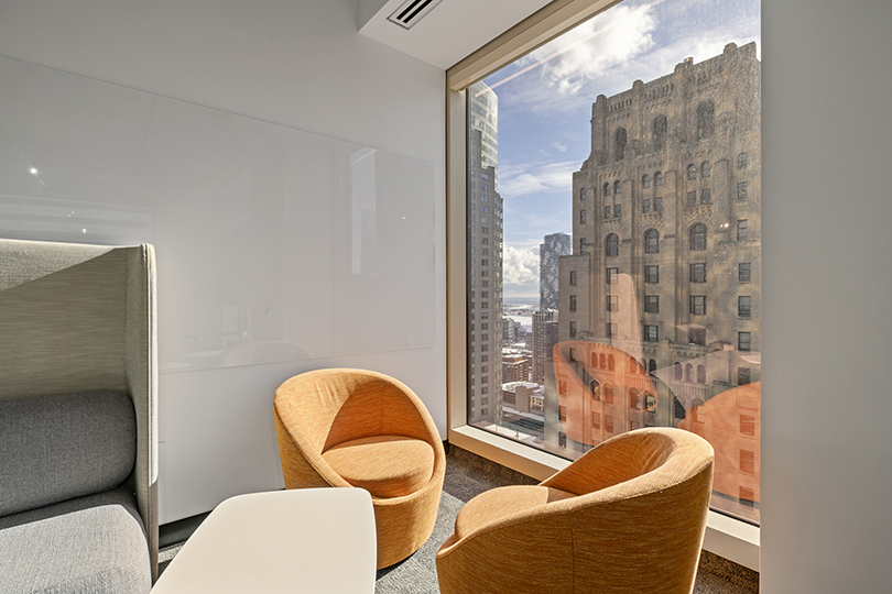 40 King St W interior view of relaxing area with orange chairs