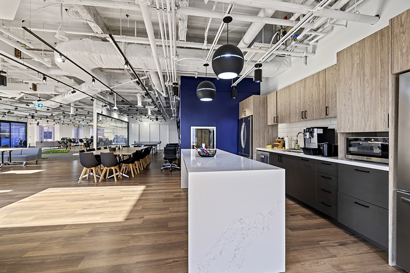40 King St W interior view of kitchen area with large island table