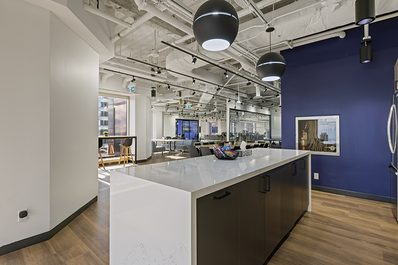 40 King St W interior view of kitchen area with large white island table