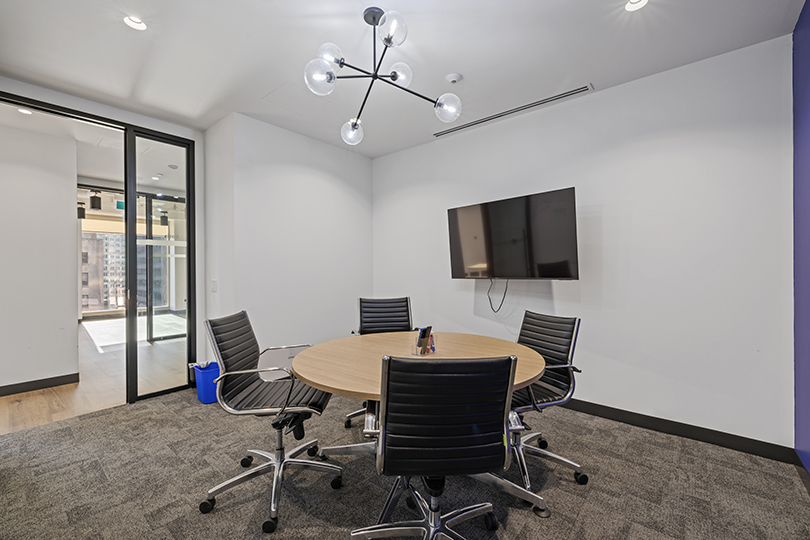 40 King St W interior view of private office with white wall and tv