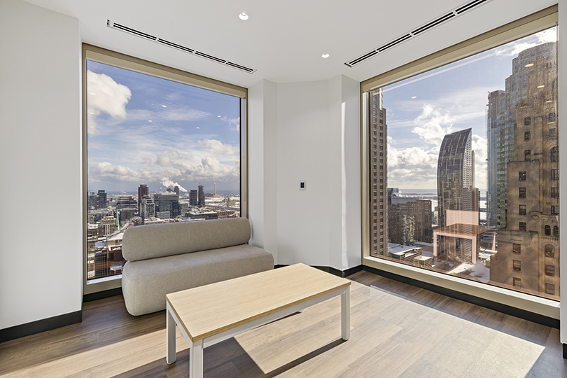 40 King St W interior view of relaxing area with white couch