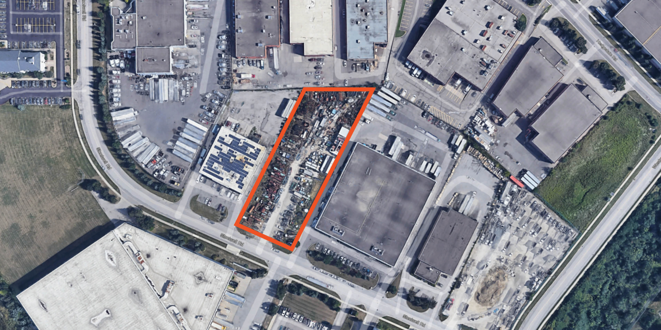 Google Earth Aerial of Land Parcel outlined in orange with trailers stored on the parcel 