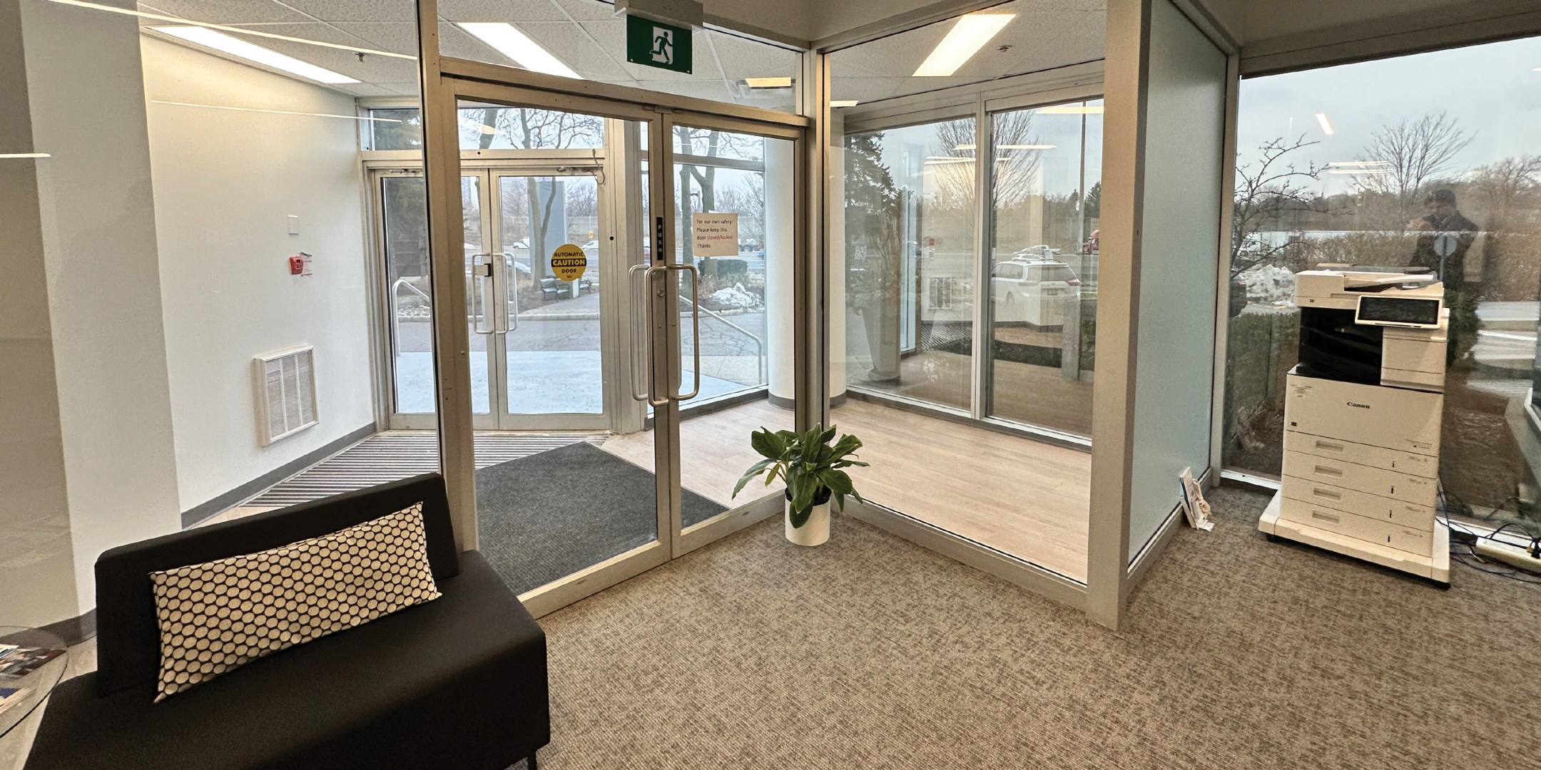 111 Gordon Baker Road main door and sofa on the side with large window and printer