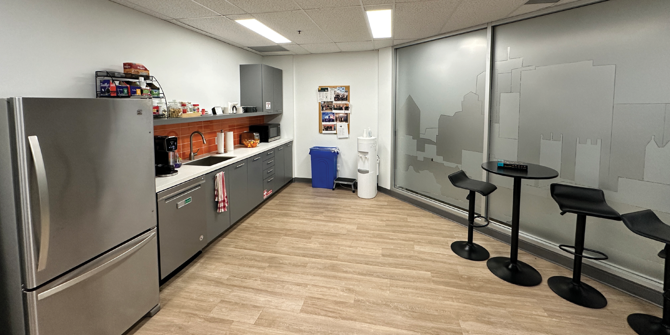 111 Gordon Baker Road kitchen area with desks and chairs and fridge