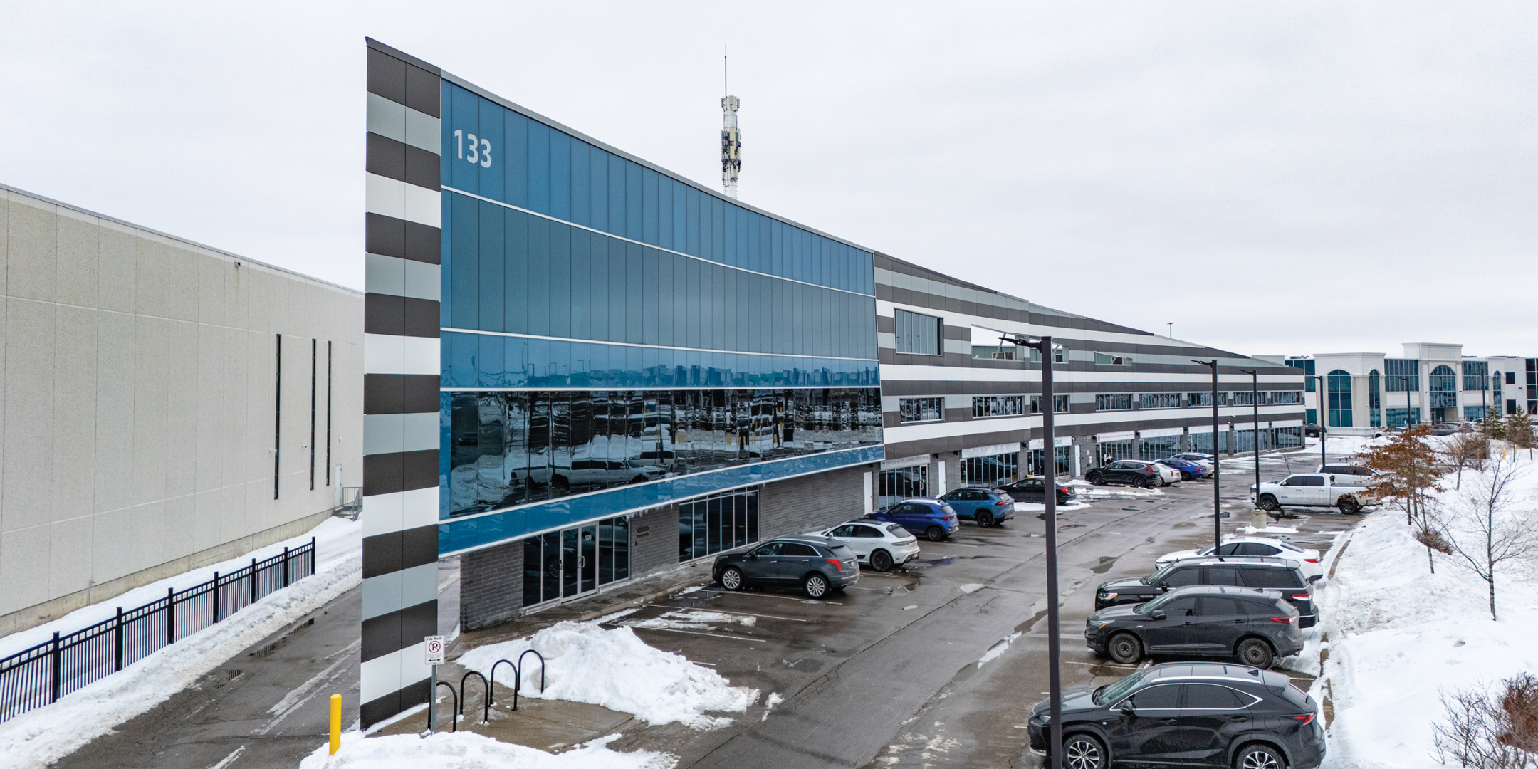 133 Milani Boulevard building exterior showing parking lot