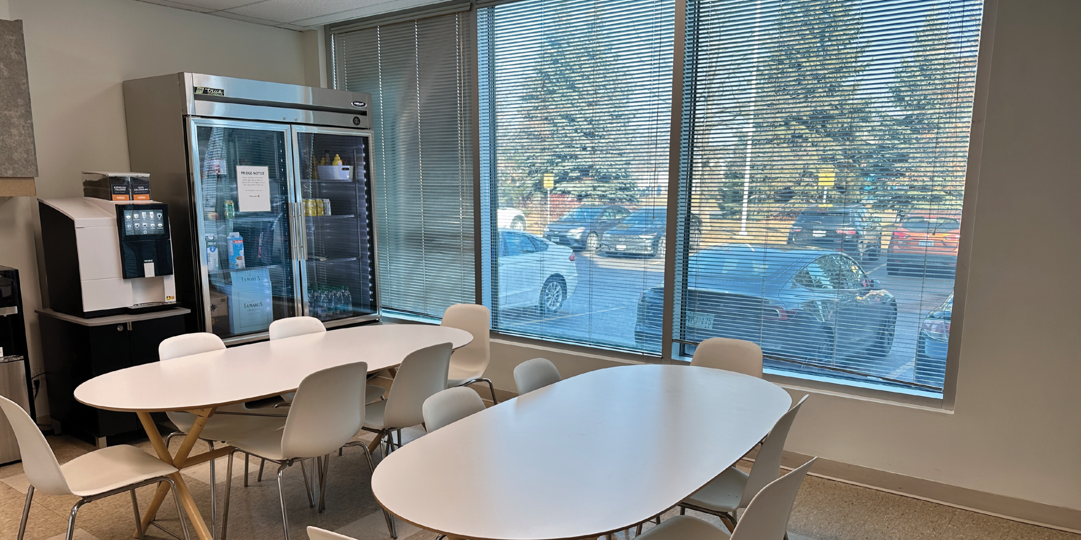 1540 Cornwall Road kitchen area with chairs and large windows