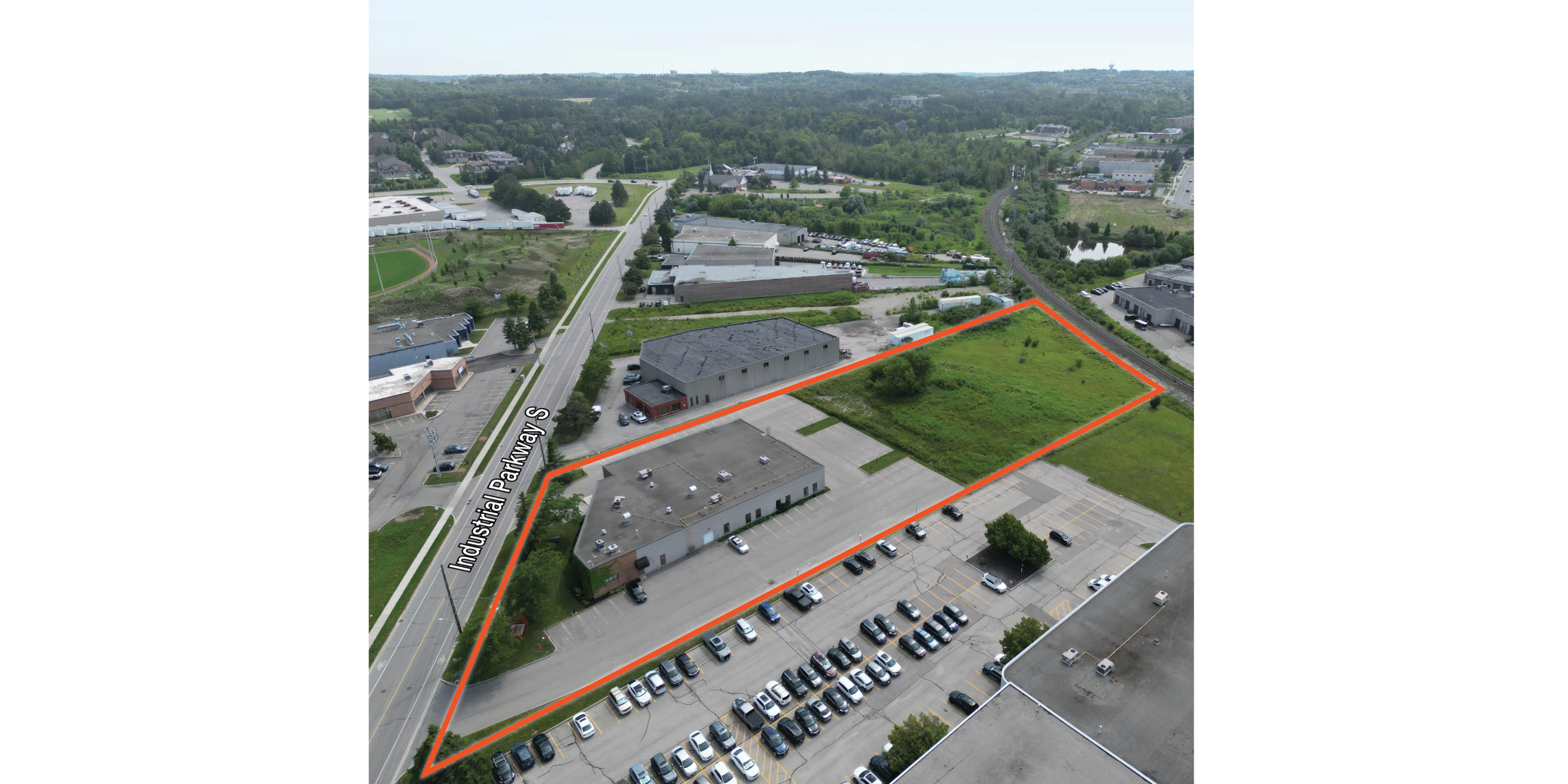 Aerial of industrial building with property outlined in orange
