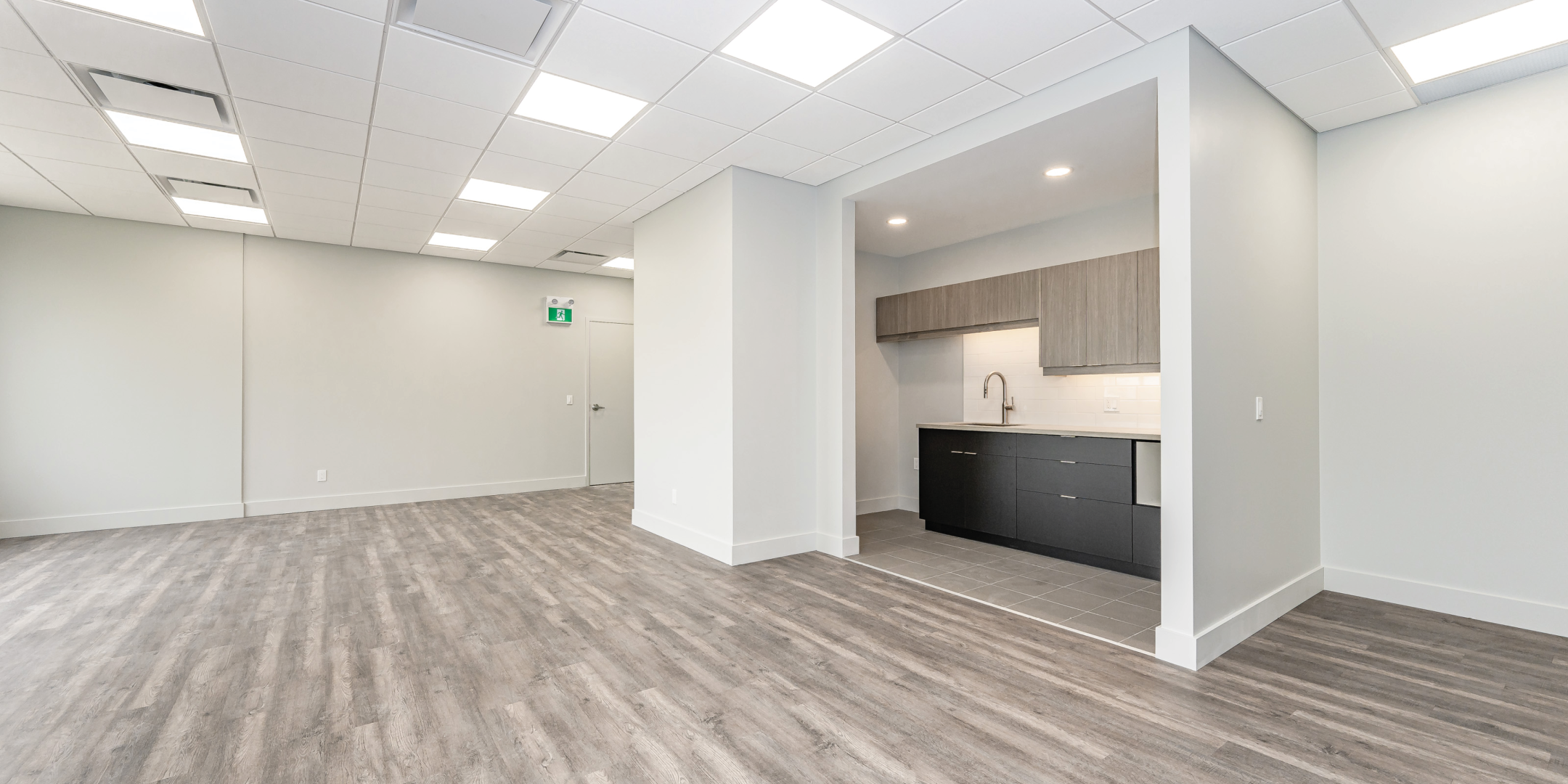 Kitchen and open area of unit J204