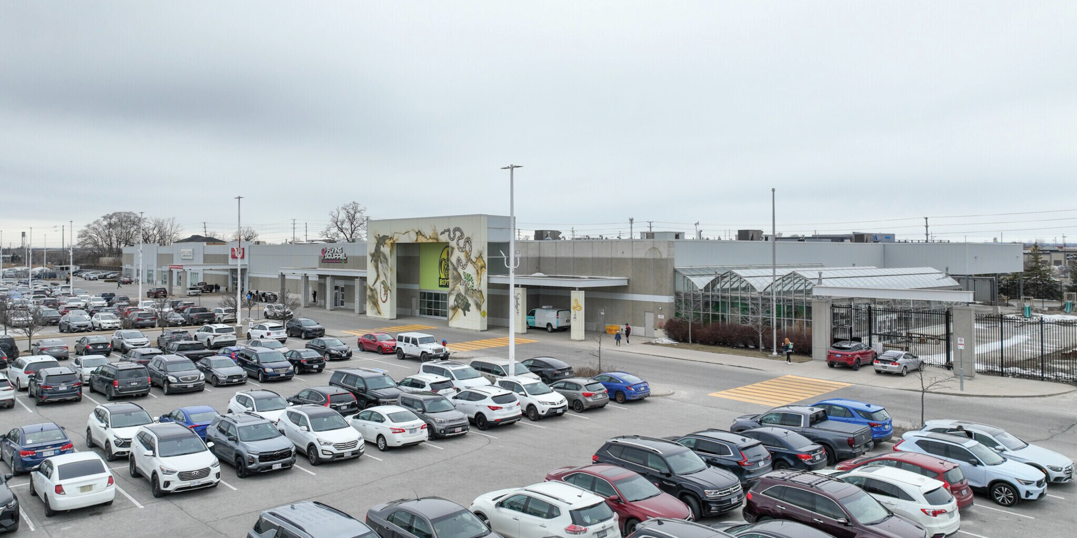 1400 Victoria Street E building exterior showing main entrance and parking