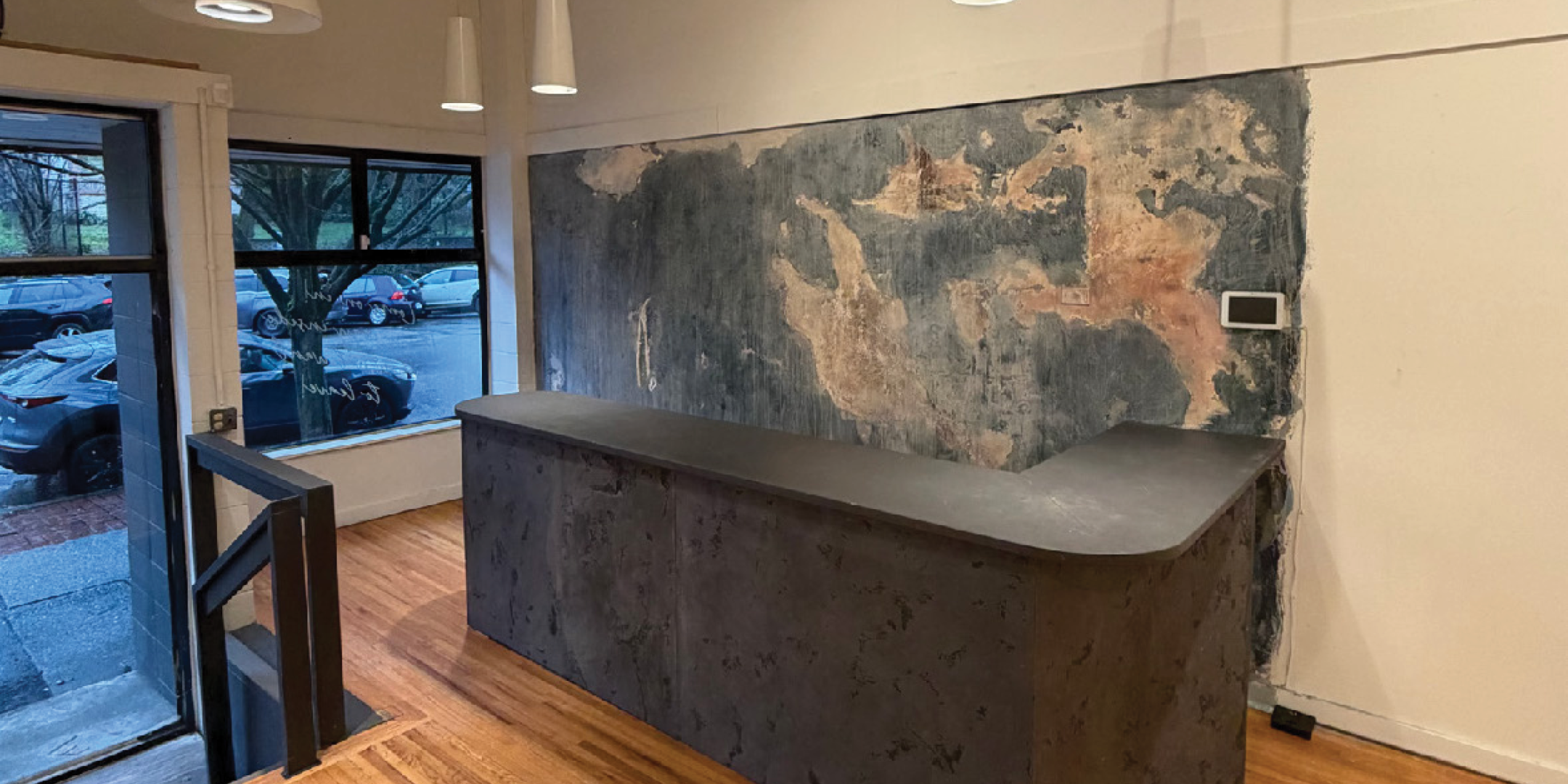 The interior of the retail space at 153 East 1st Street, Unit 161 showcasing the cash or reception area. 