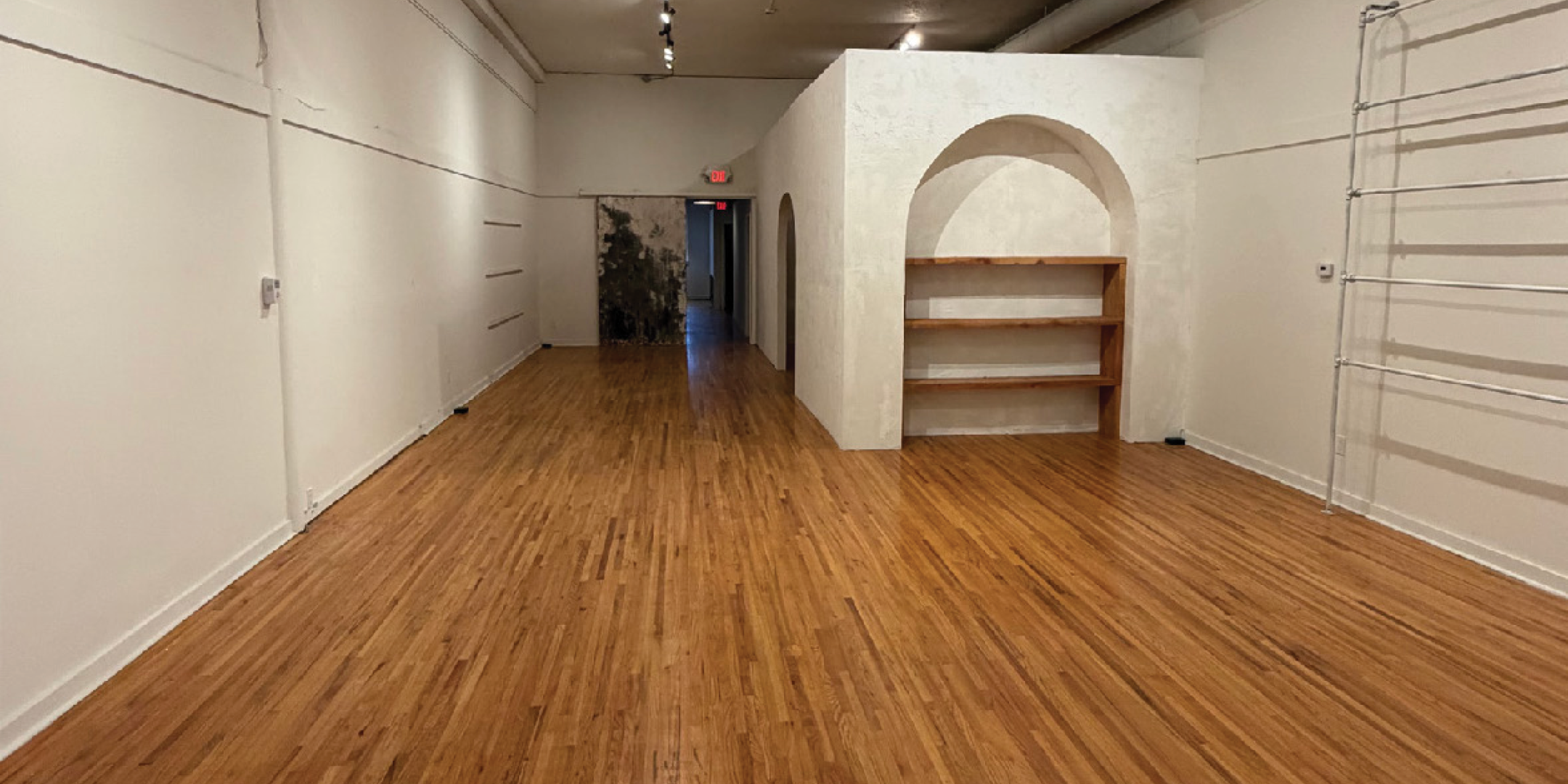 The interior of the spacious retail space at 153 East 1st Street, Unit 161.