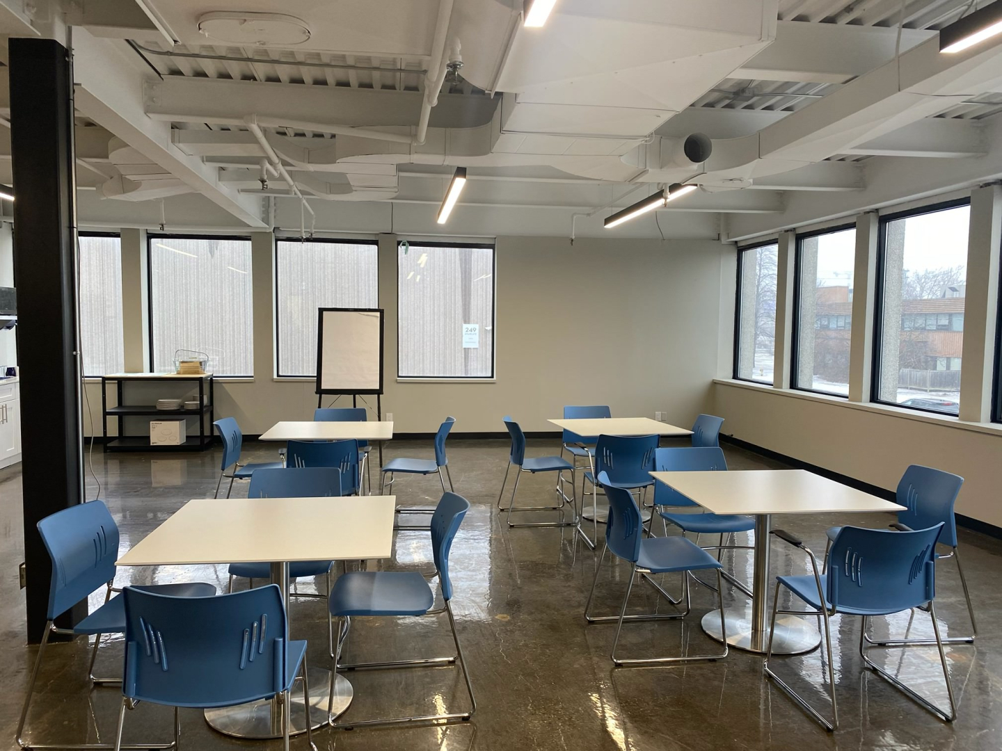 36 Horner Avenue office area with windows, desks and blue chairs