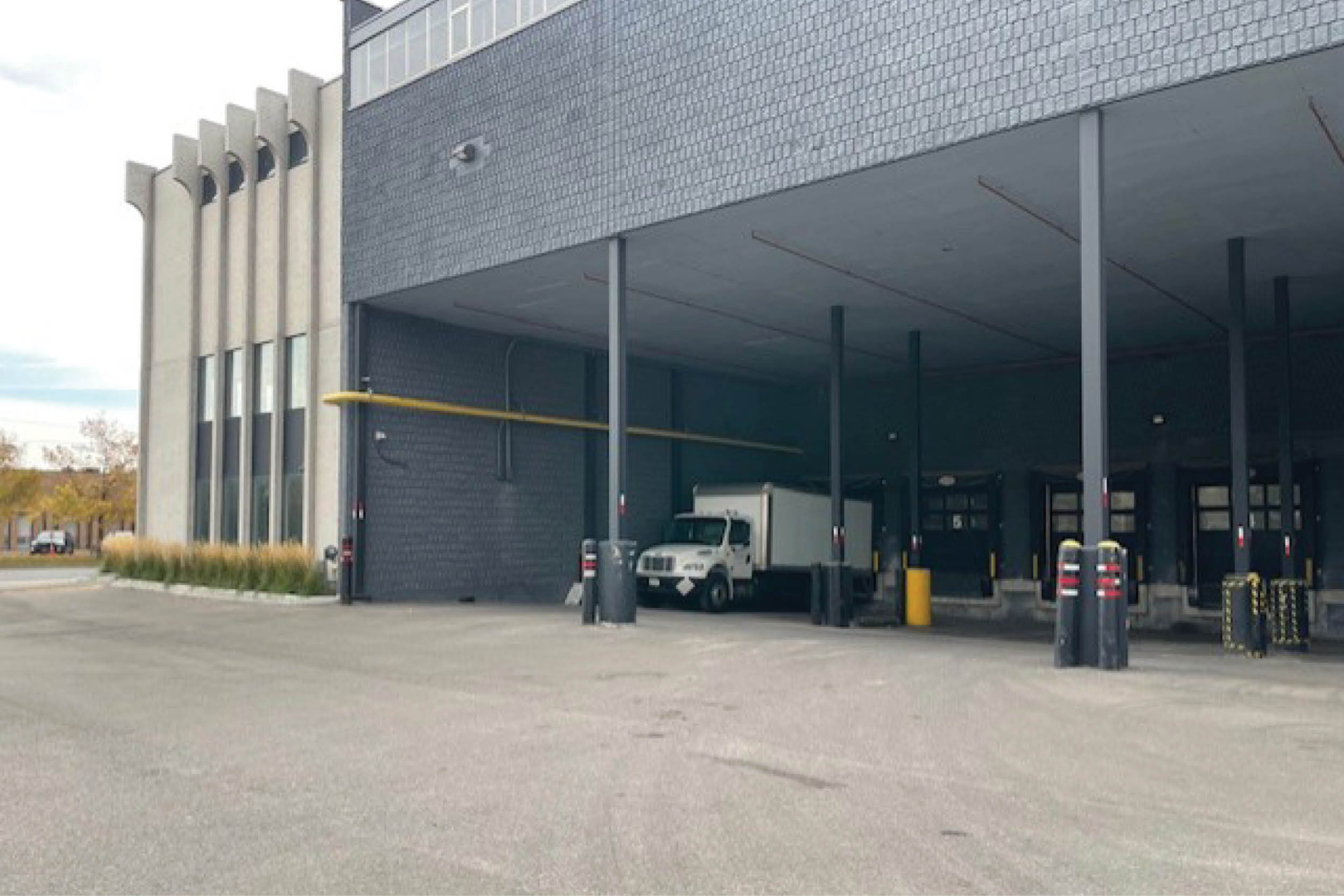 36 Horner Avenue exterior loading dock with covered bays and a truck parked underneath