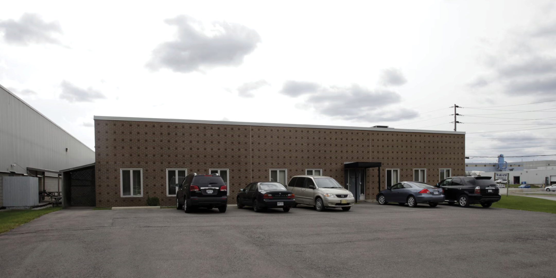 96 Armstrong Avenue building exterior with main entrance and parking