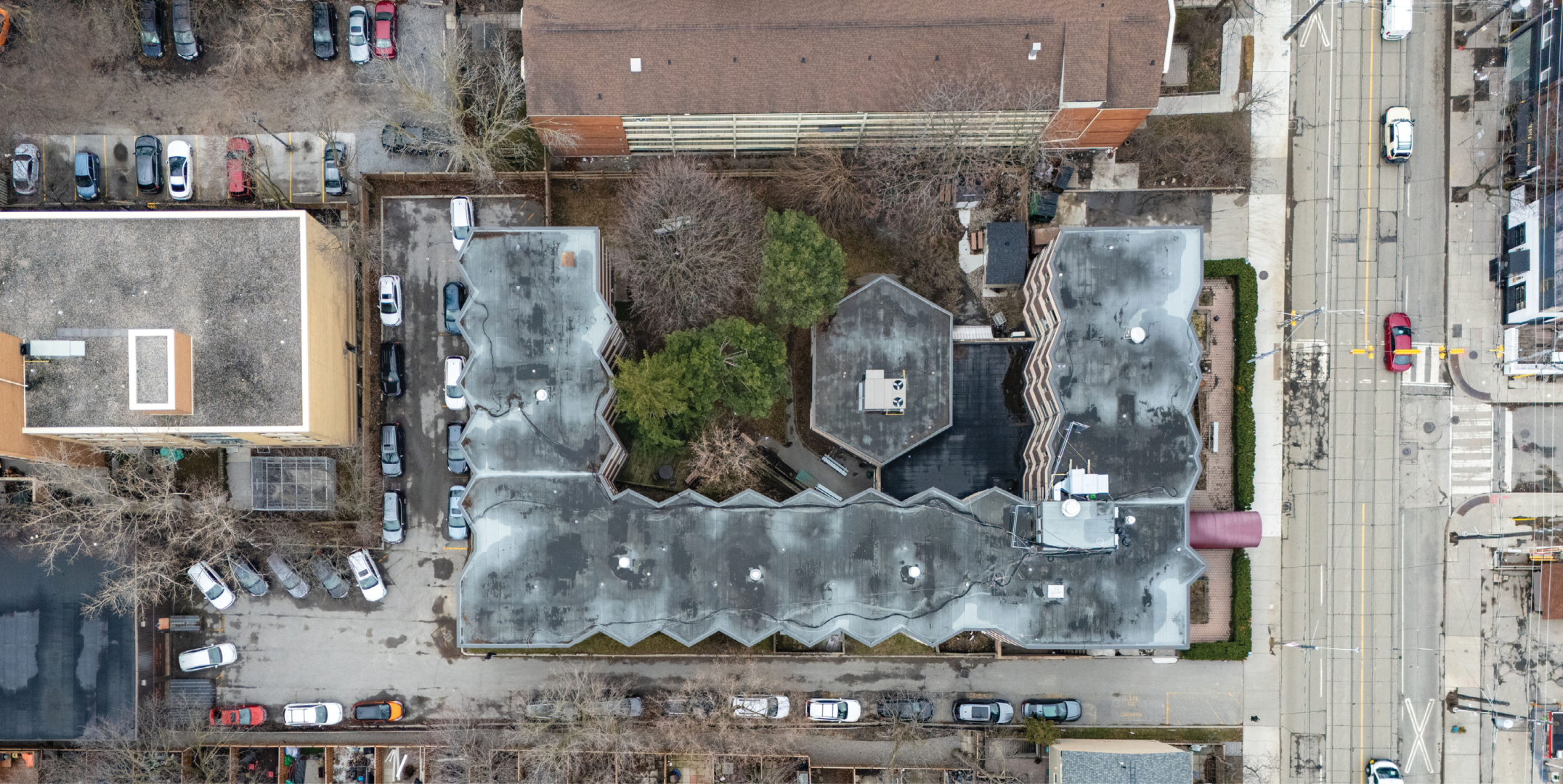 1195 Queen Street E top-down aerial view of building and parking