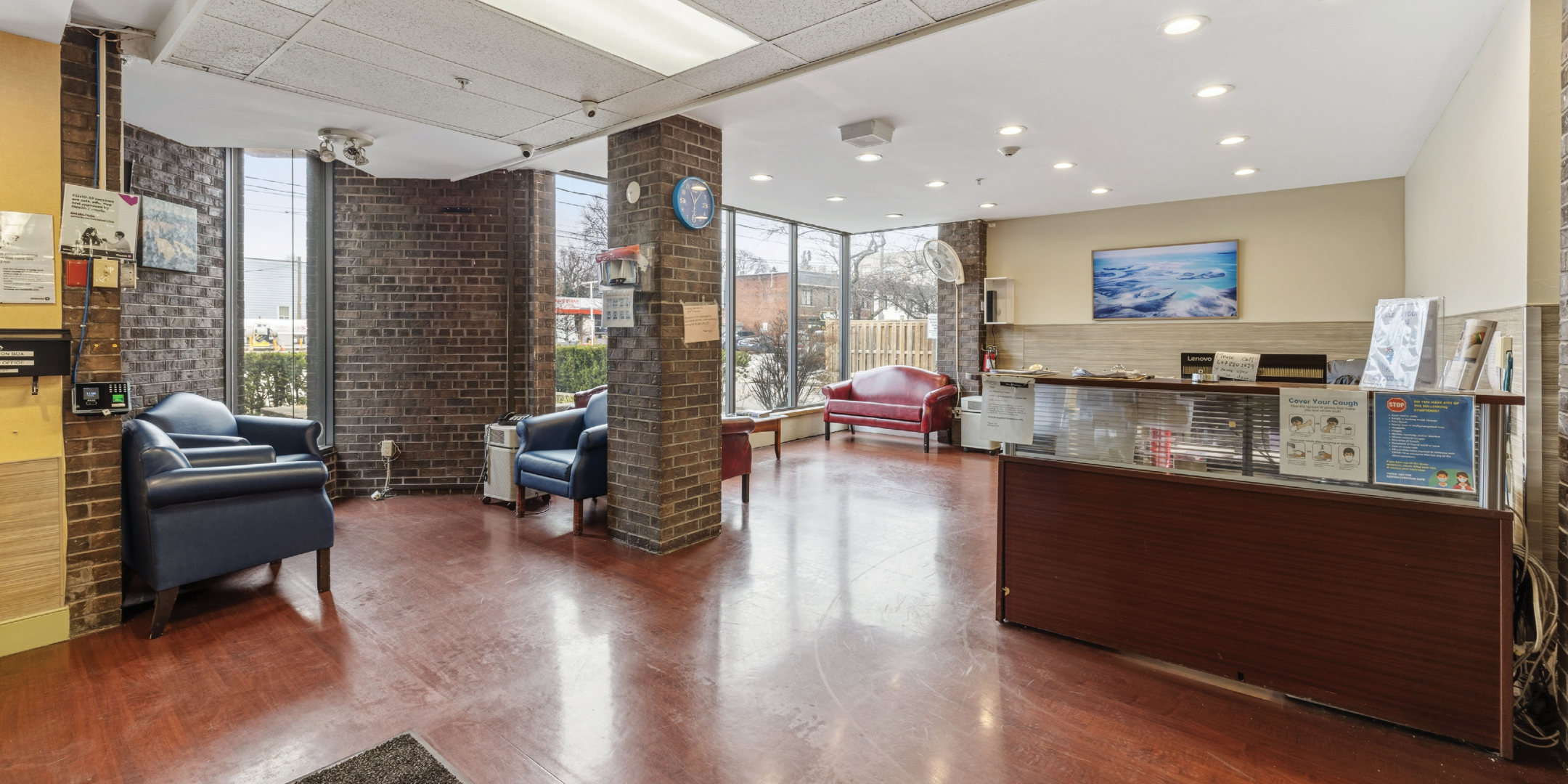 1195 Queen Street E reception area with seating and front desk