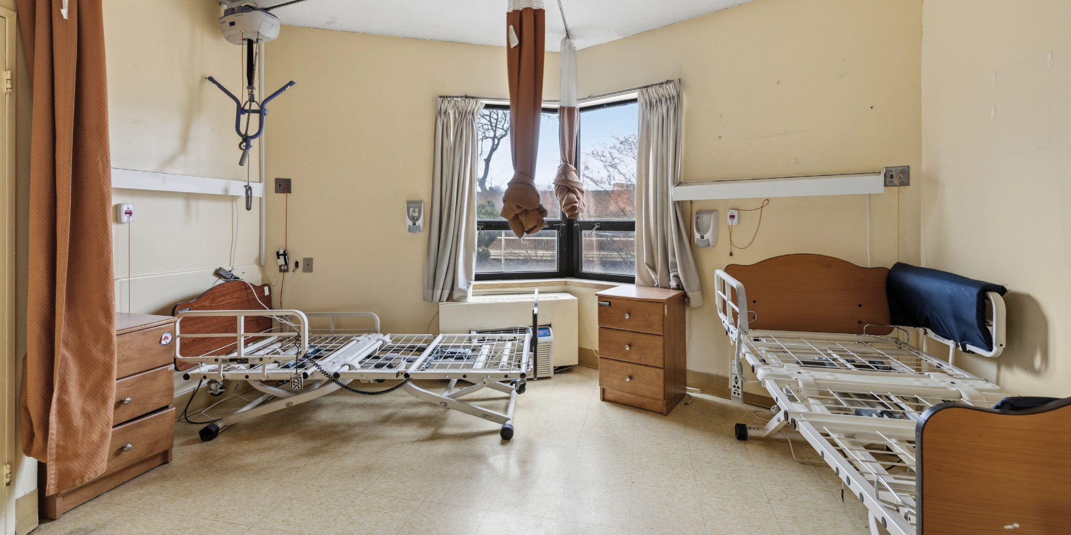 1195 Queen Street E patient room with beds near window
