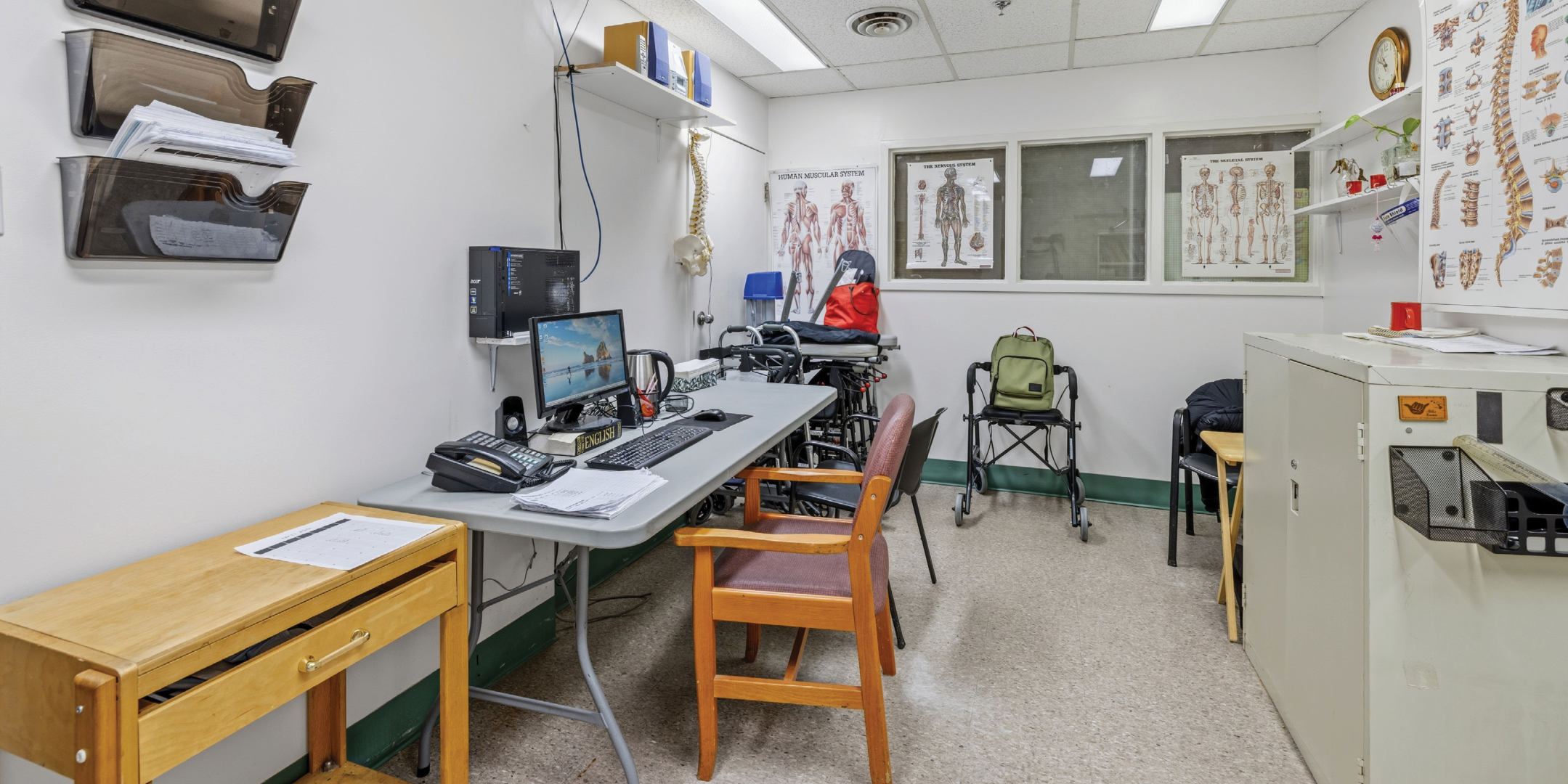 1195 Queen Street E office space with desk and medical equipment