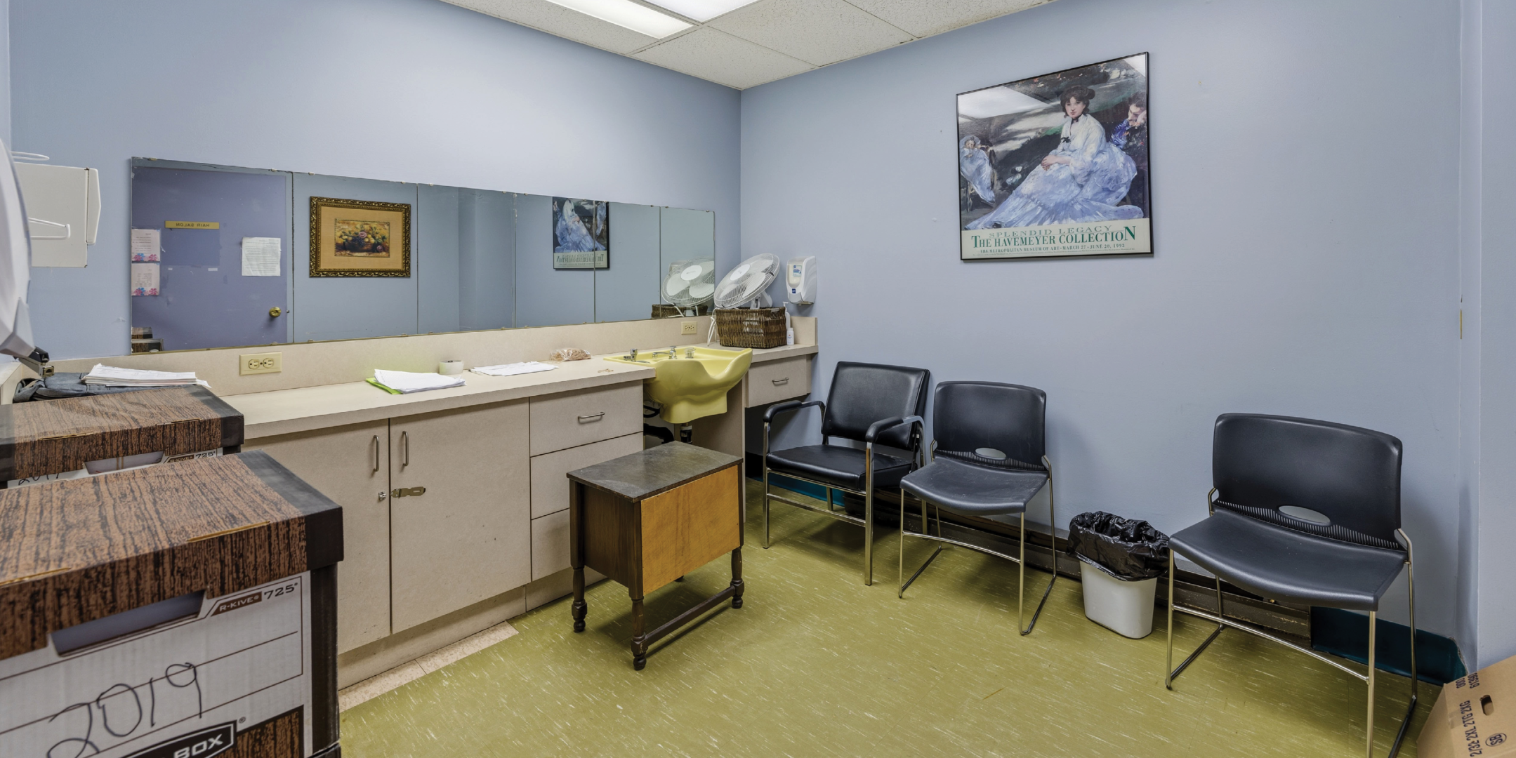 1195 Queen Street E small room with chairs and sink area.
